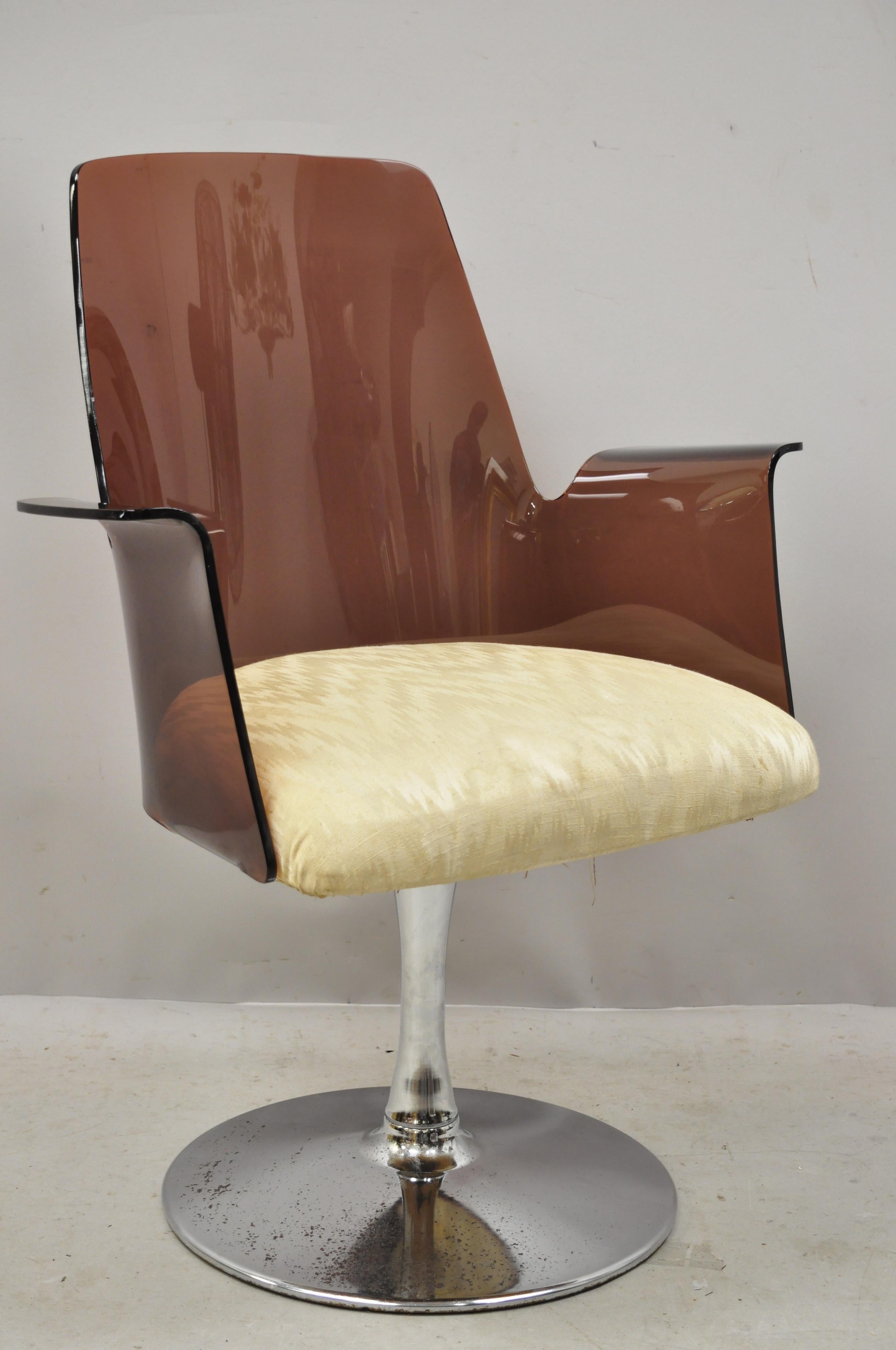 Vintage Laverne style curved cranberry Lucite tulip swivel base armchair (A). Item features a swivel seat, metal 