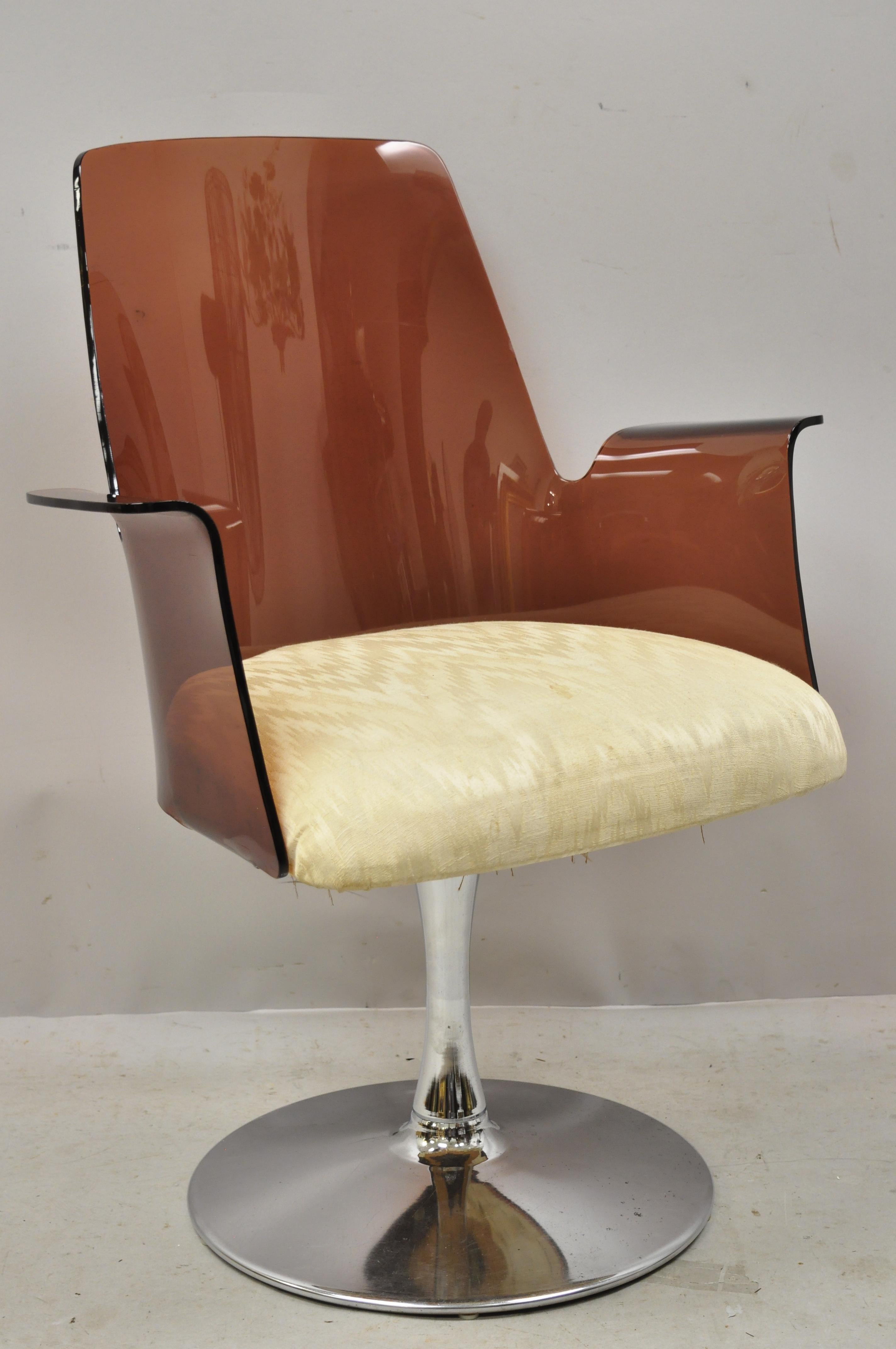 Vintage Laverne style curved cranberry Lucite tulip swivel base armchair (B). Item features a swivel seat, metal 