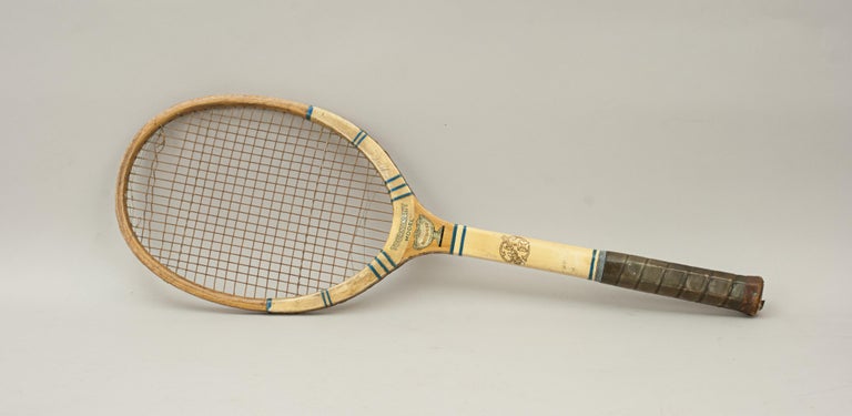 Vintage tennis racket, FH Ayres
A good F. H. Ayres wooden tennis racket entitled 'The Tournament, Davis Cup'. The racket has some good colorful trade design labels and still has it's original leather grip and butt cap. Some of the strings are