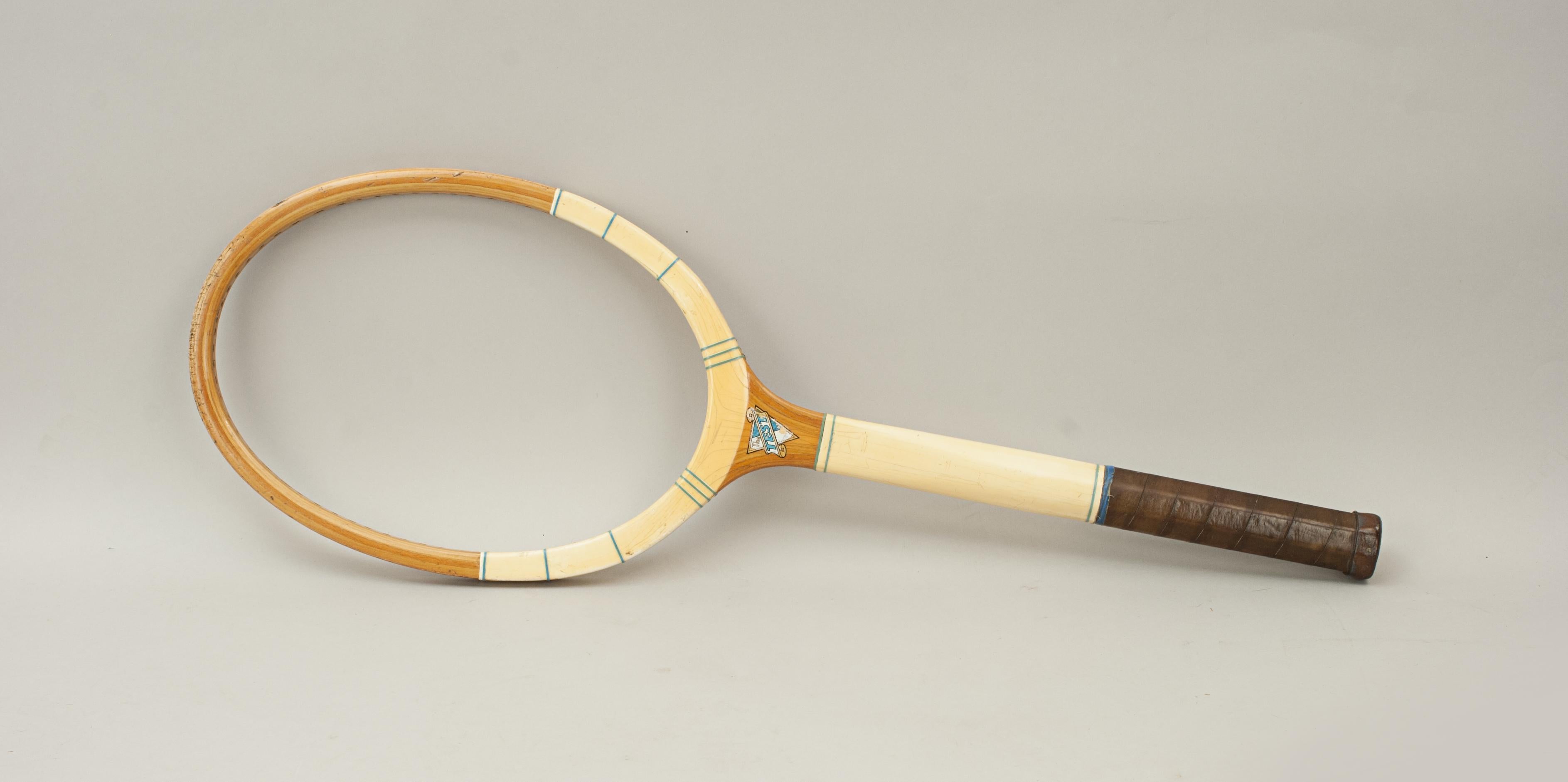 The test wooden framed lawn tennis racket.
A good wooden laminated framed tennis racket called The 'TEST'. The throat with colourful decal one side, The 