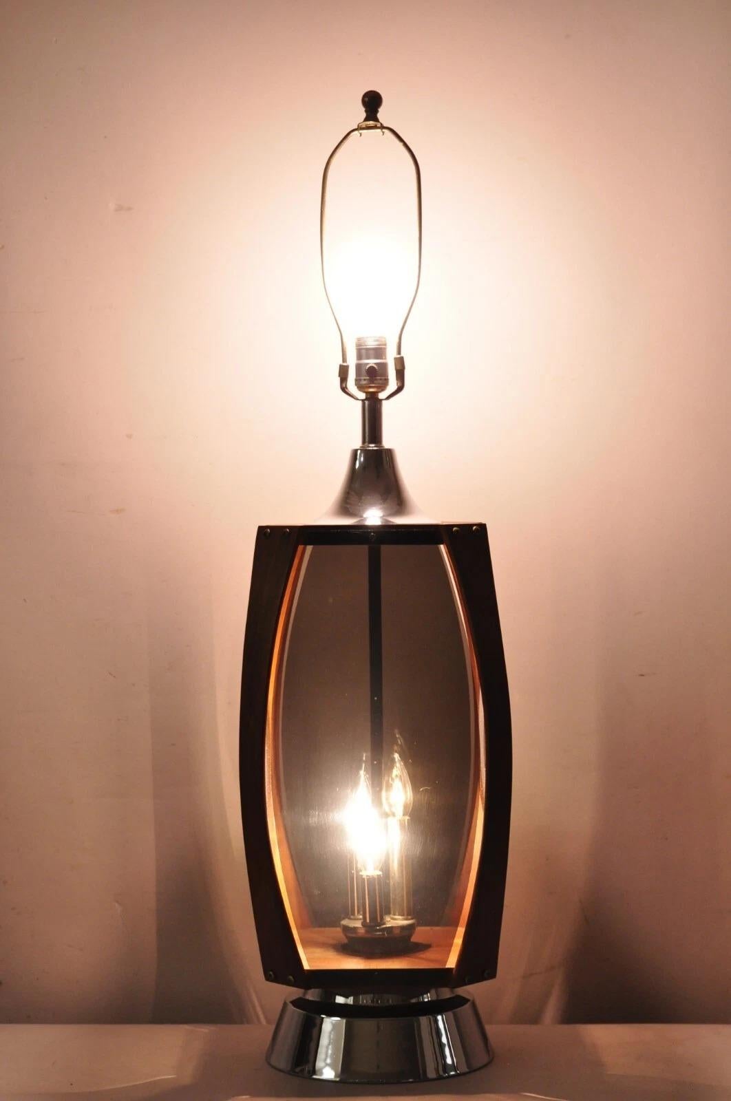 Vintage Lawrin Mid Century Modern Walnut, Chrome, and Smoked Plexiglass Table Lamp With Interior Lights. Circa Mid 20th Century. Measurements: 39