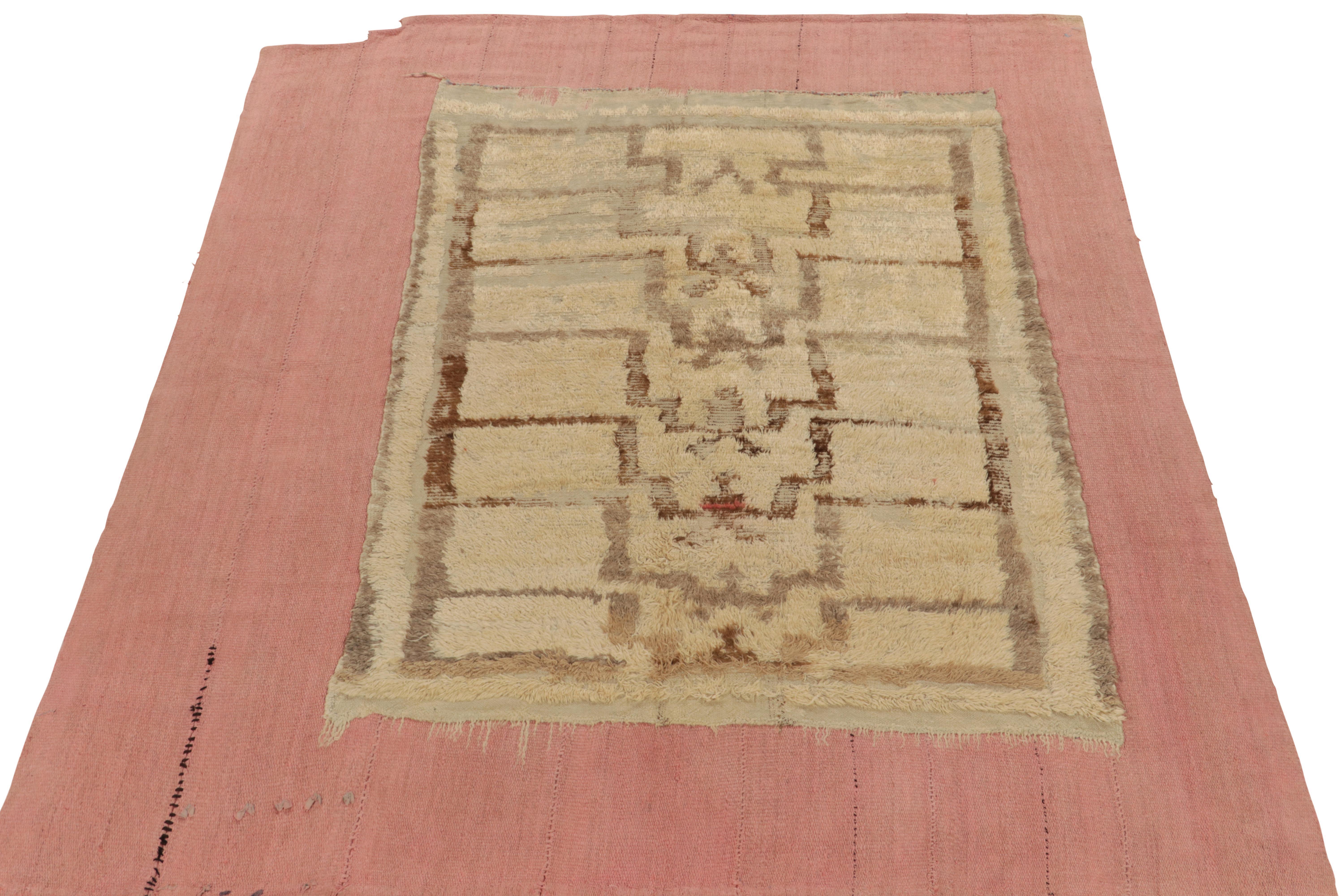 A 7x8 vintage piece from one of the most unique Kilim collections, layering mid-century pile and flat weave rugs into a dynamic modern form. Handwoven in wool, playing shag pile in beige brown against pink for a superimposition of pattern and