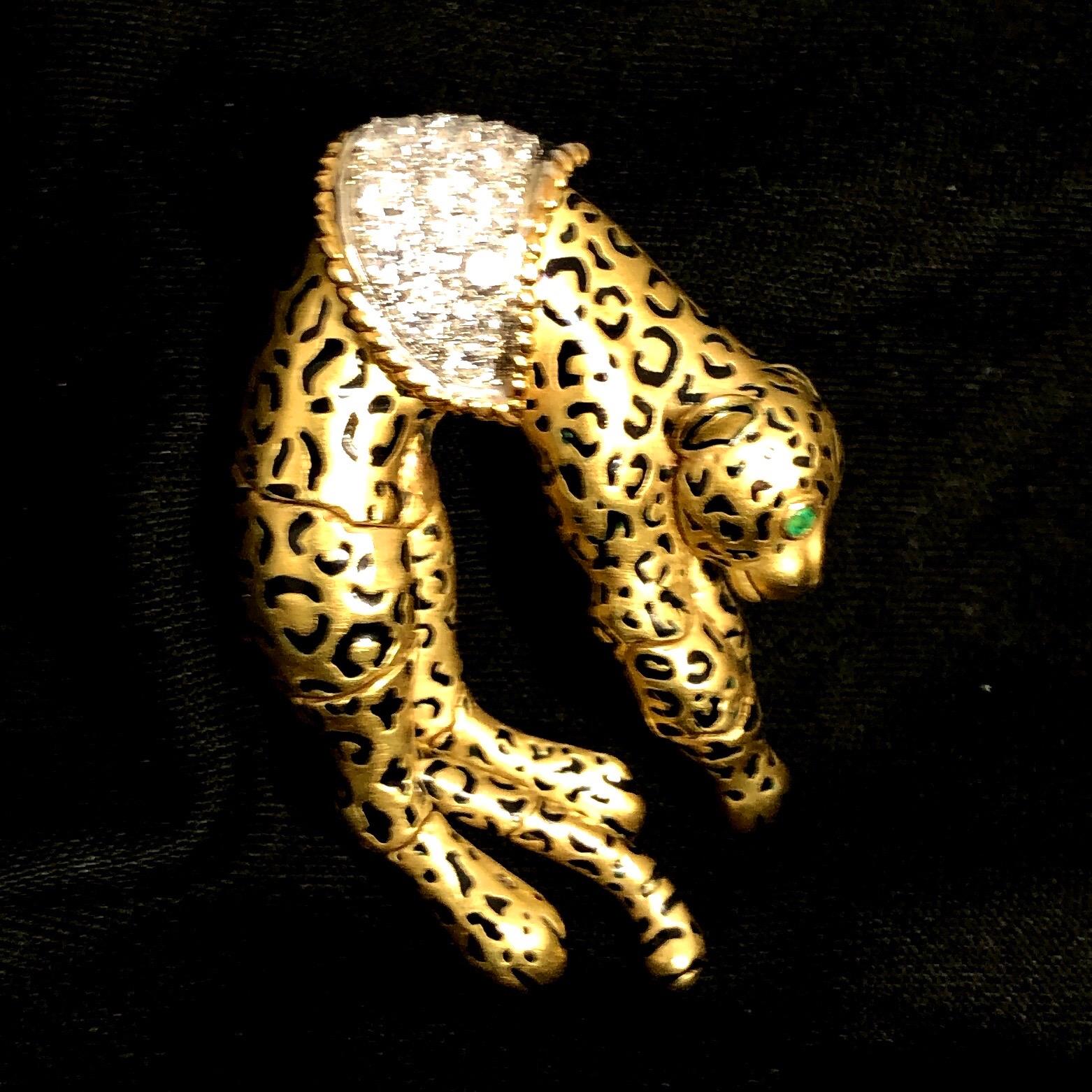 This lovely and whimsical mid-20th century Leopard brooch is positively stunning and was manufactured with a great deal of attention to detail. The entire brooch has the rich patina of age and all it's spots are in gloss black enamel. Both eyes are