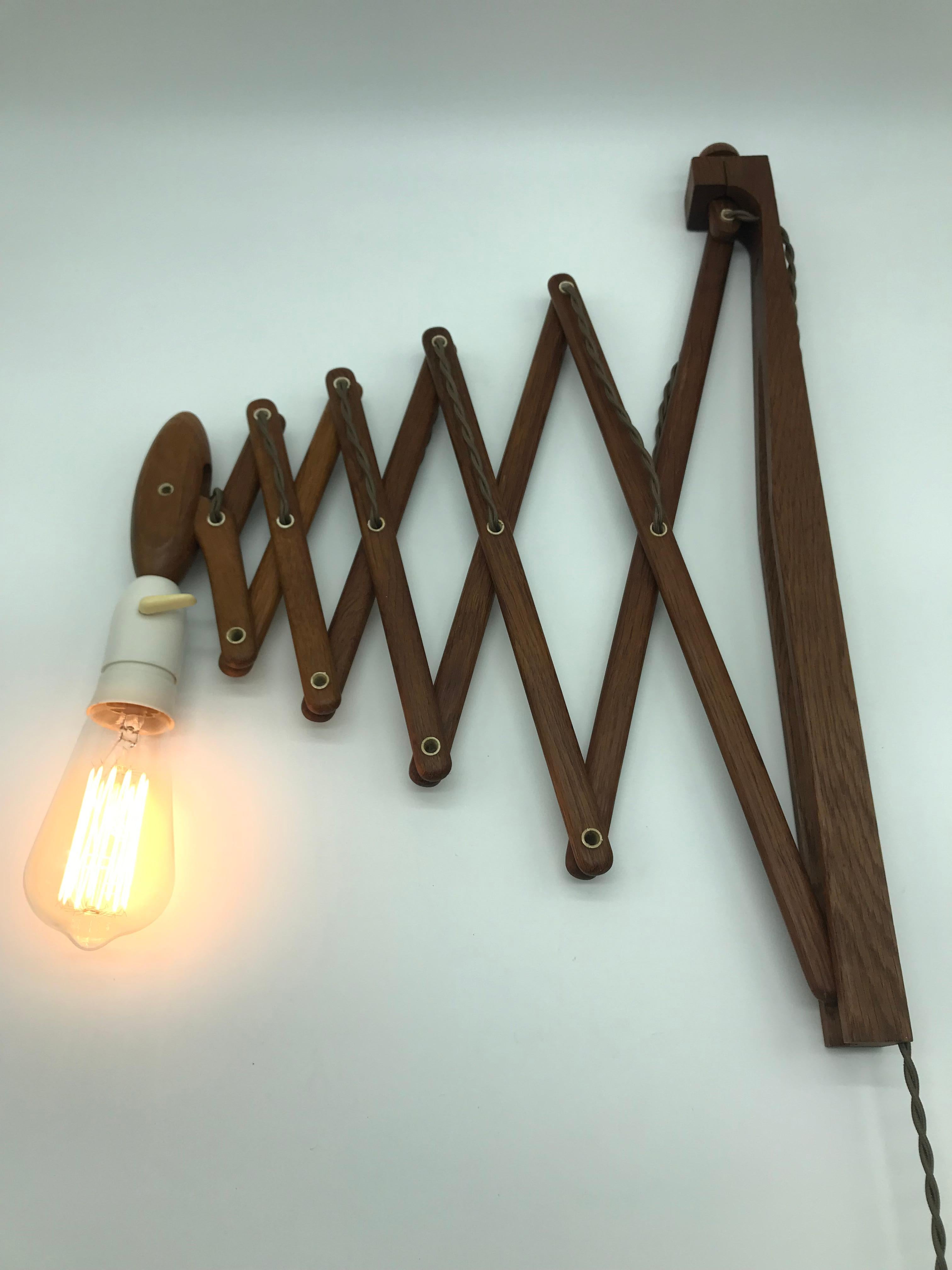 Iconic Vintage Le Klint scissor lamp down light in teak from the 1960s and designed by Erik Hansen
In great vintage condition with new wiring and ready to use. 
Danish design and quality at its best.