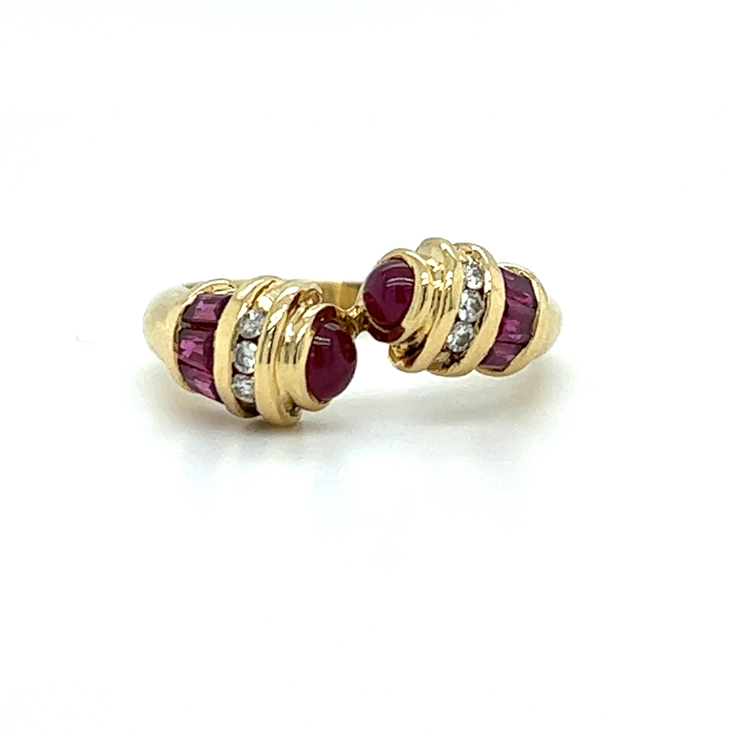 One 18 karat yellow gold bypass ring designed by LeVian, set with two (2) 3.5mm round cabochon natural rubies, six (6) 3x2mm natural baguette rubies and six (6) round brilliant cut diamonds, approximately .12 carat total weight with matching G/H