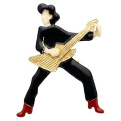 Broche vintage de Lea Stein con forma de guitarrista, de Rhodoid