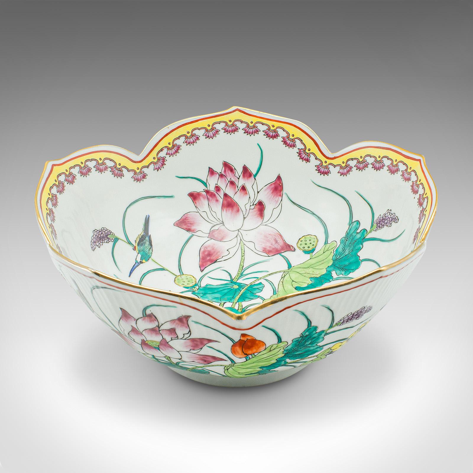 
This is a vintage leaf form fruit bowl. A Chinese, ceramic decorative dish with lotus flower motif, dating to the Art Deco period, circa 1940.

Enticingly formed bowl, accentuated with wonderful decor
Displays a desirable aged patina and in good