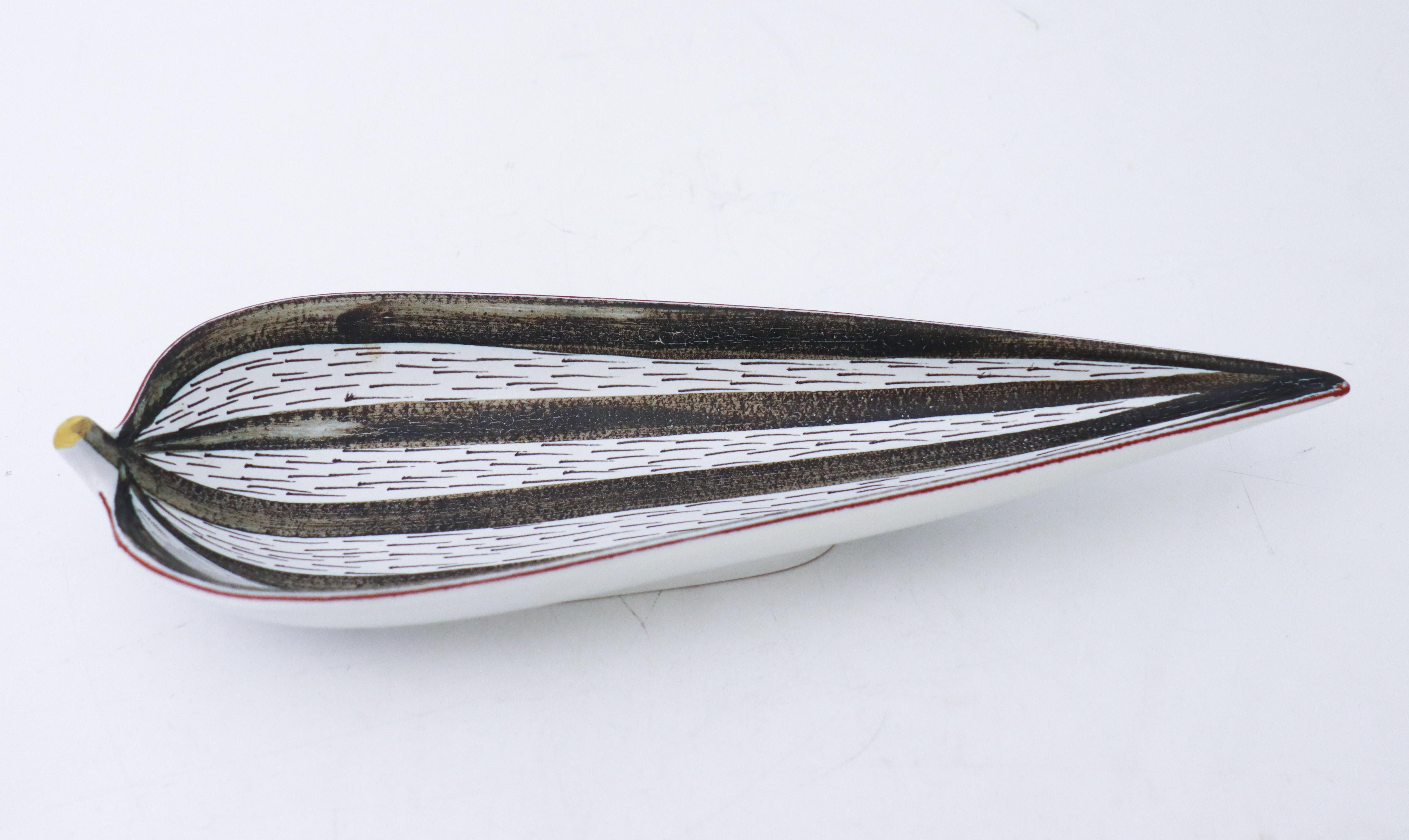 A serving dish in faience designed by Stig Lindberg at Gustavsbergs Studio in Stockholm, it is 31.5 x 10.5 cm (12.6