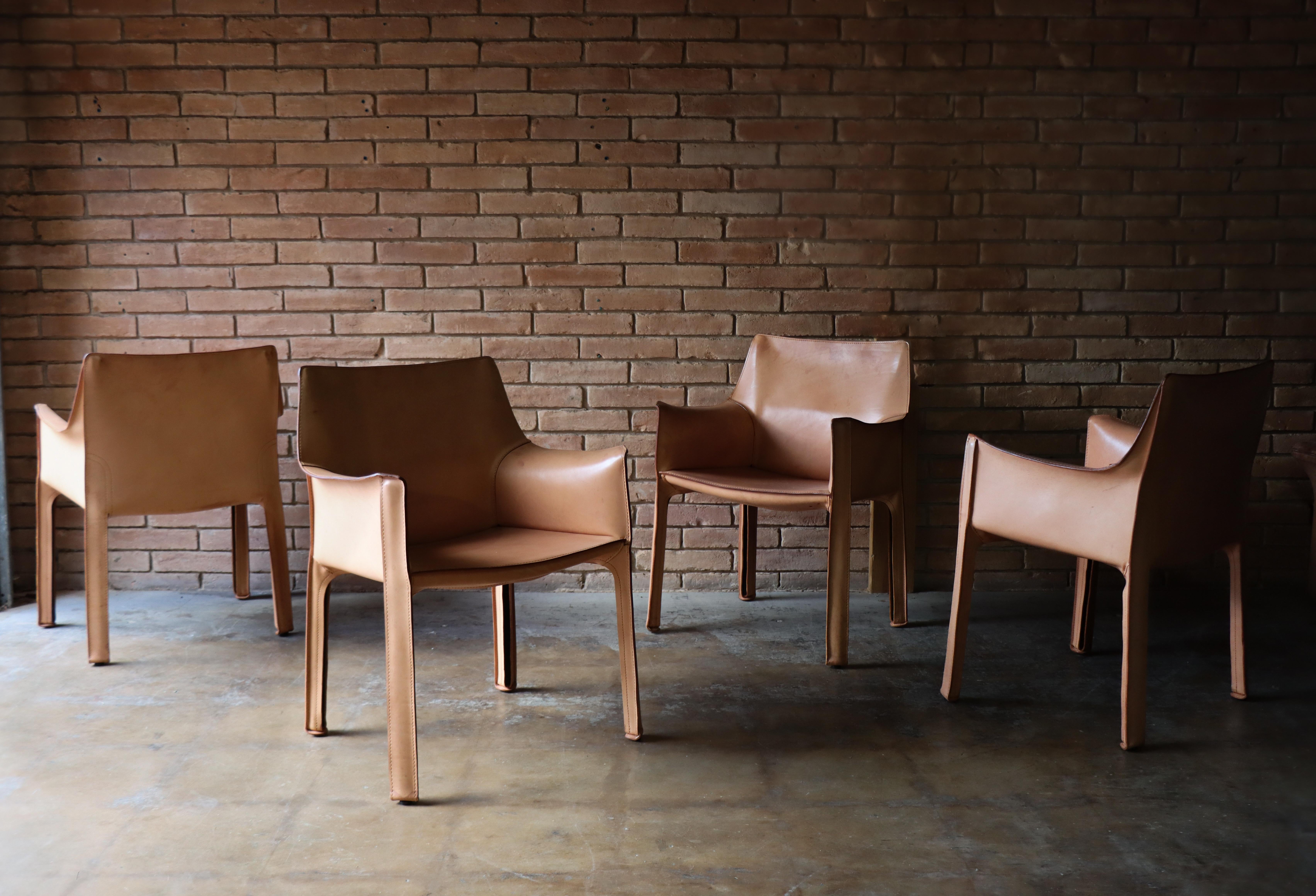 Striking set of four original Mario Bellini ‘CAB’ chairs, designed in 1977 for Cassina. These iconic chairs are crafted in nude, vegetable-tanned leather that has developed a natural patina over time — a testament to their age. The leather wraps