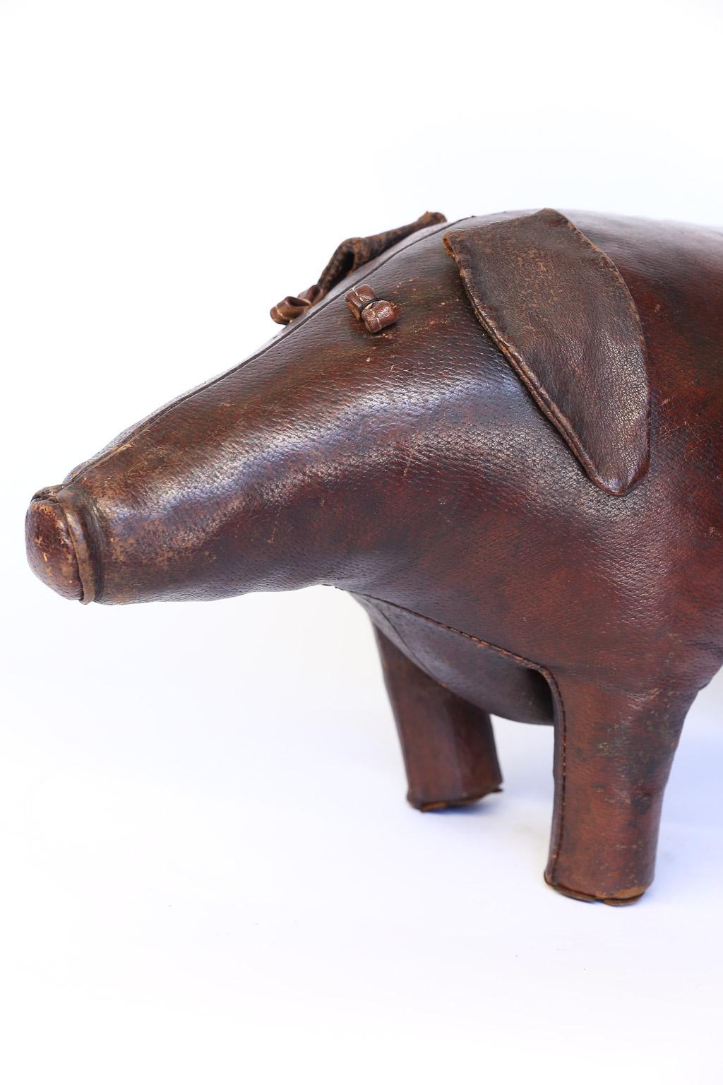 Beautiful leather footstool by Dimitri Omersa in the shape of a pig. Omersa Co., England, produced several leather animals as footstools for Abercrombie and Fitch. This sweet pig is a wonderful conversation piece and useful as a footstool.