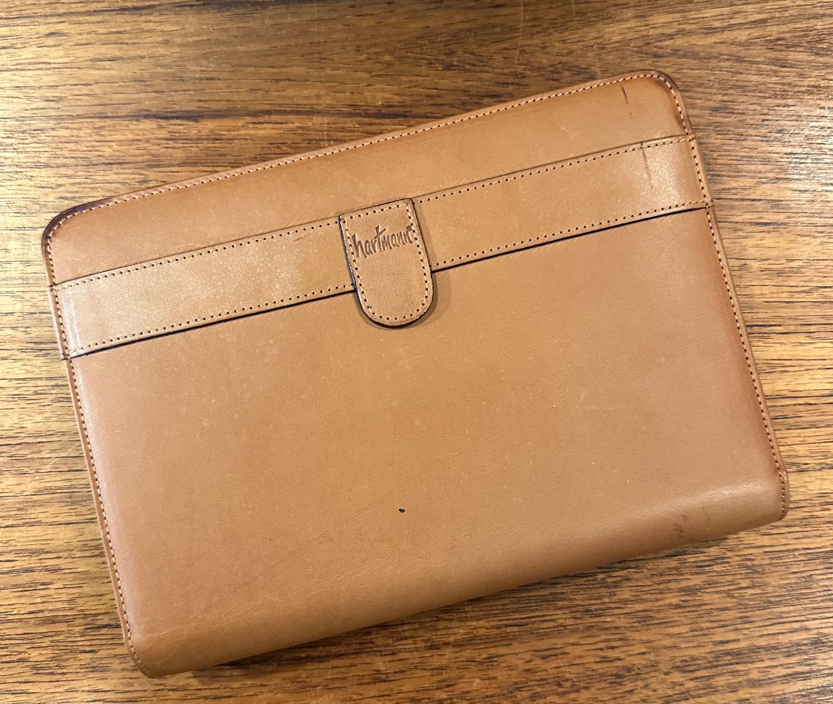 Vintage leather address / phone book by Hartmann, circa 1980s.  The leather book is in good vintage condition and has never been used; it measures 6