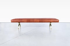 Banc vintage en cuir et laiton