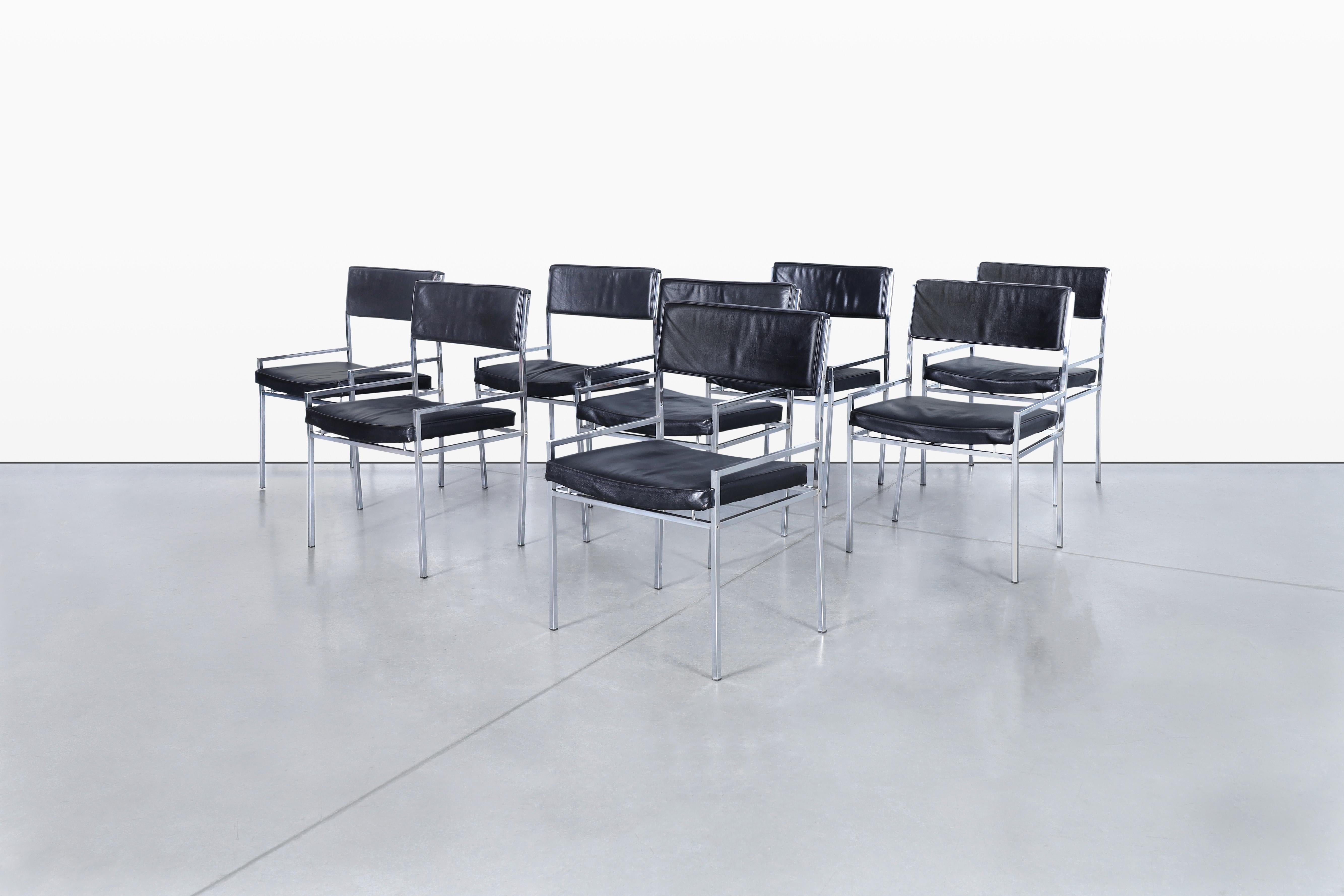 Presenting a stunning set of eight vintage dining chairs designed by Georg Petersens for Georg Petersens Mobelfabrik. These chairs feature a sleek chrome frame that not only provides stability but also adds a touch of contemporary elegance to any