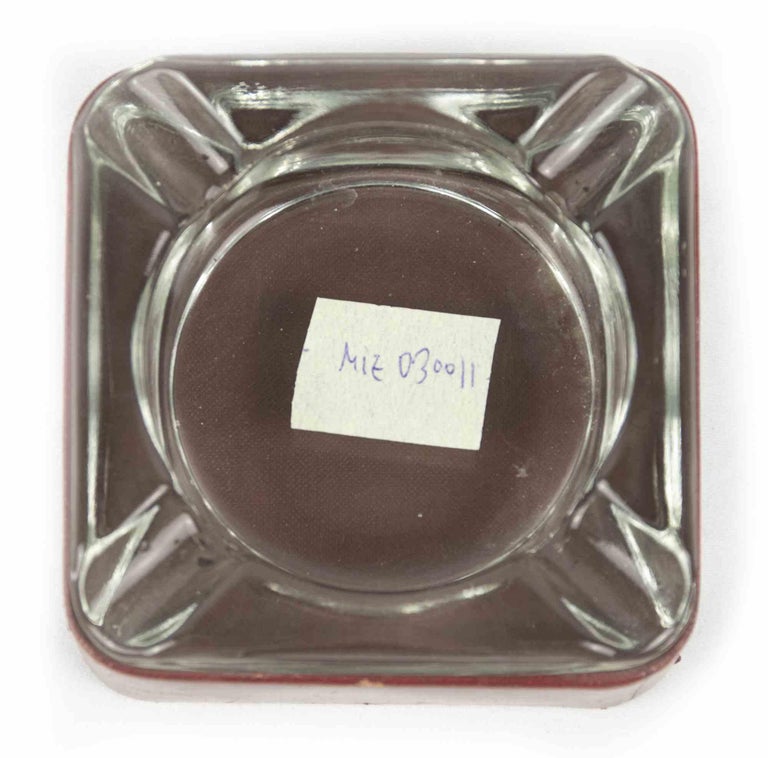 Vintage leather and glass ashtray is an original decorative object realized in the 1970s.

An art glass ashtray and a leather purple base. The base realized in leather can be unhooked.

A perfect object to enjoy relax moment.

Mint conditions.