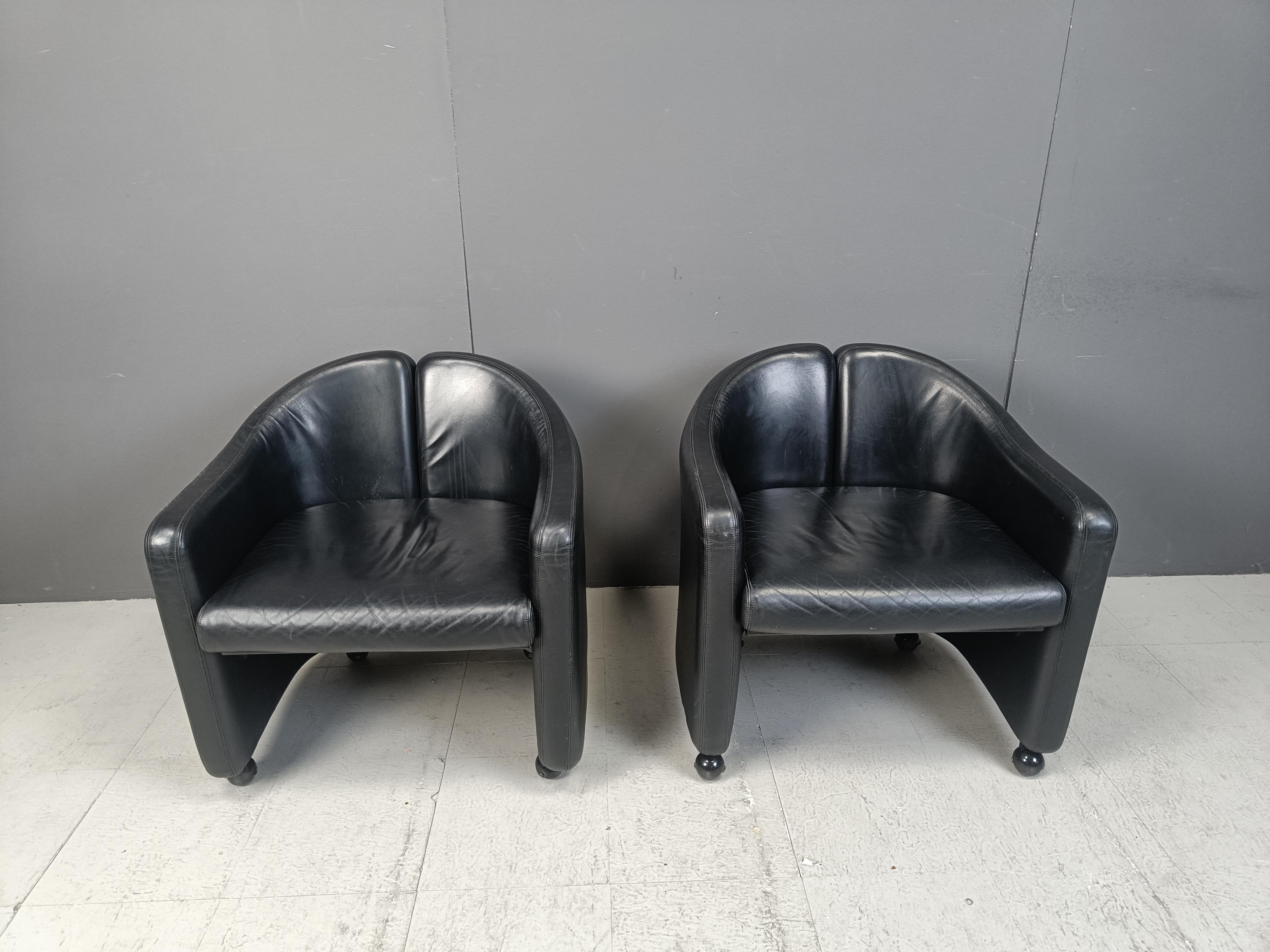 Pair of black leather armchairs Designed by architect Eugenio Gerli for Tecno Milano 1966

These beautiful 'split back' armchairs sit very well.

Good condition

Labeled.

1970s - Italy

Dimensions
Height: 70cm
Width: 70cm
Depth: 65cm
Seat height: