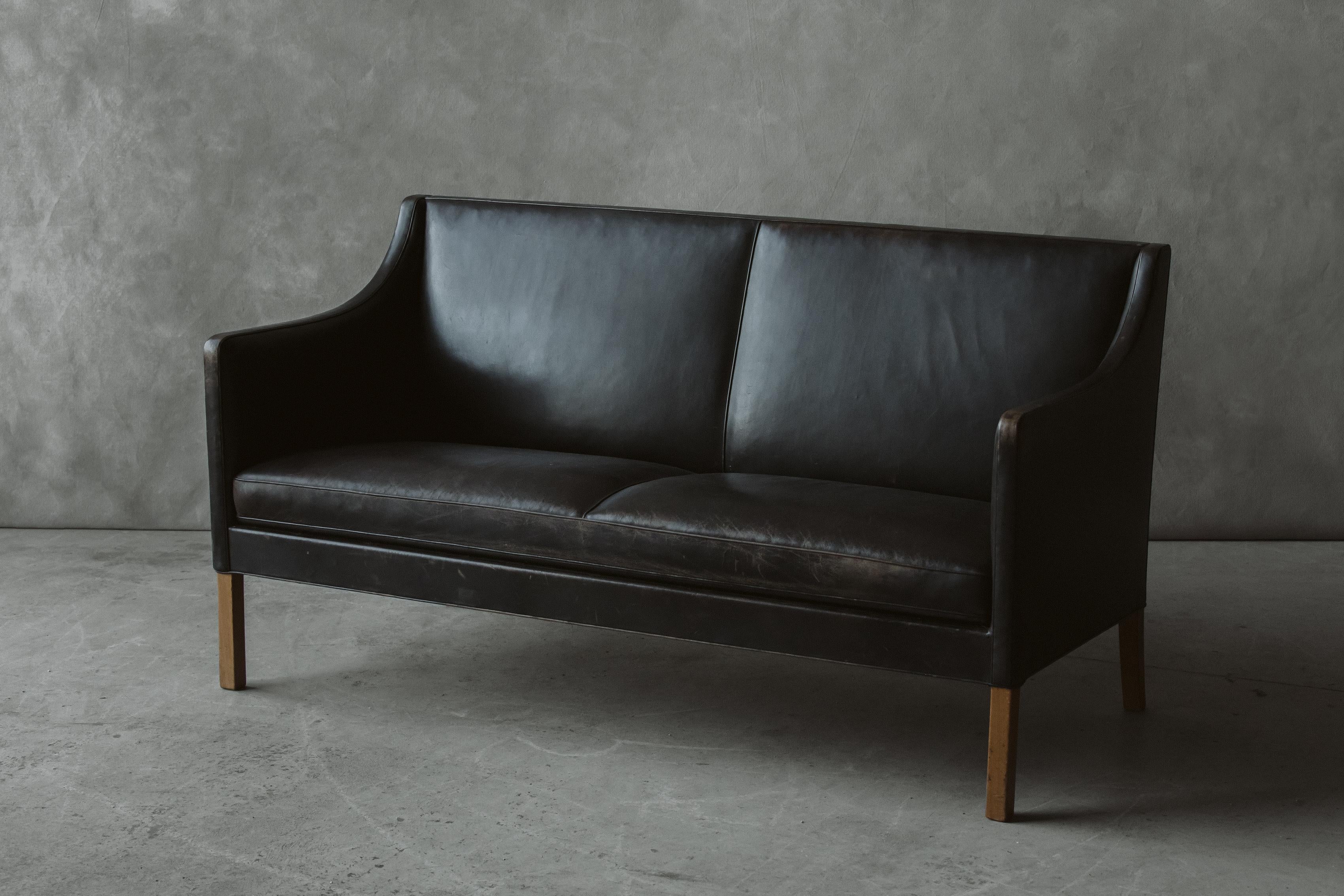 Vintage leather cabinetmaker sofa From Denmark, circa 1950. Original black leather upholstery with great wear and patina. 

We prefer to speak directly with our clients. So, If you have any questions or would like to know more please give us a