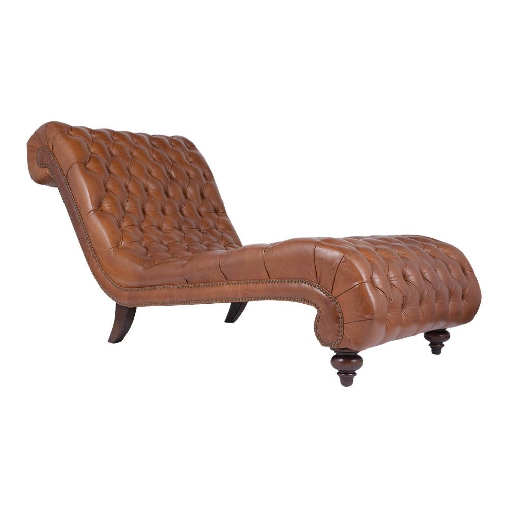 This Chesterfield Leather Chaise Lounge has been newly restored, features a fully tufted upholstery the seat/ back that contours to the human body making it perfect lounging and resting on. The Lounge is dyed in a cognac color with a beautiful