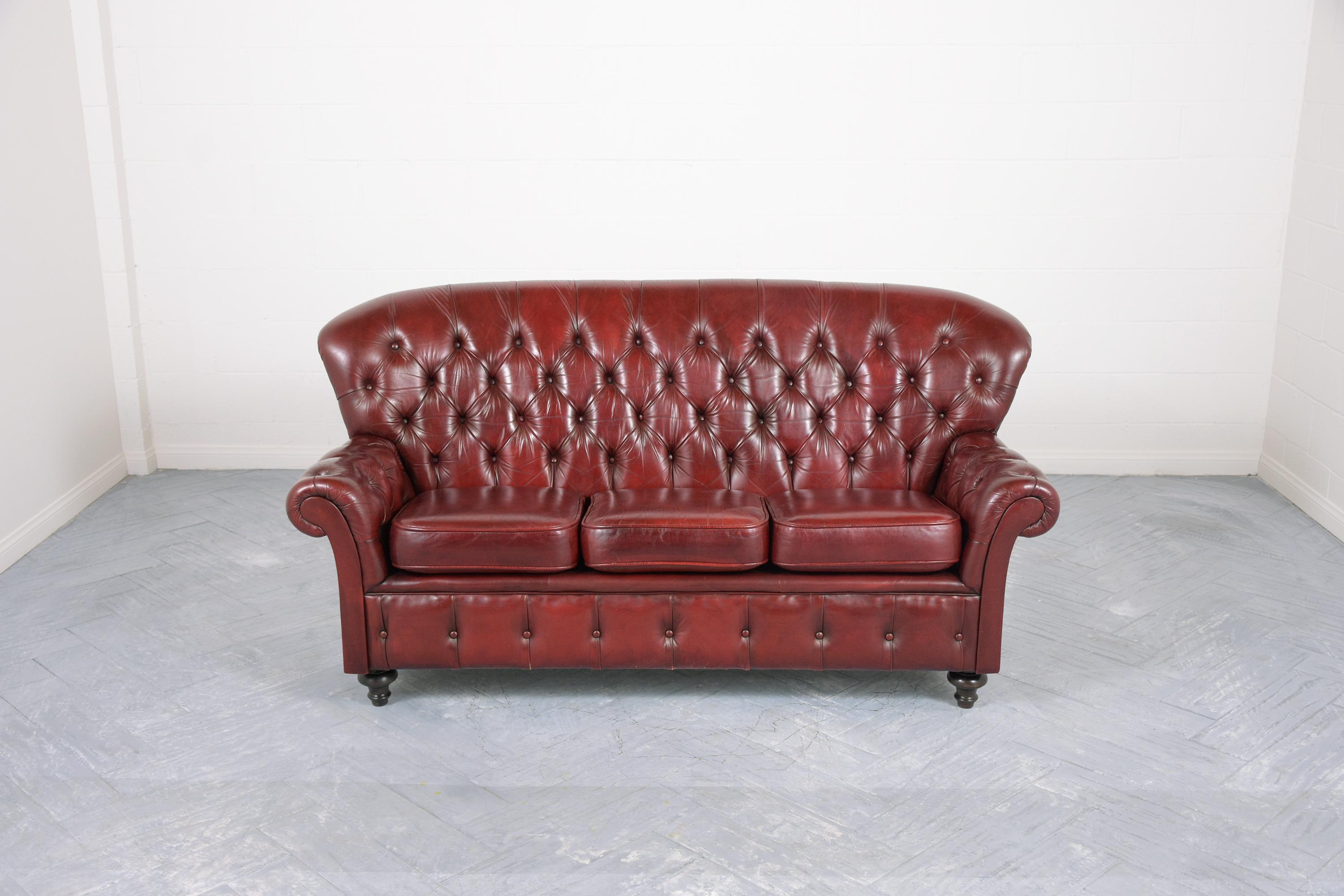 An extraordinary vintage leather tufted chesterfield sofa in good condition beautiful crafted out of wood and leather combination newly restored by our professional craftsmen team. This piece features high backrest scrolling arms with a tufted