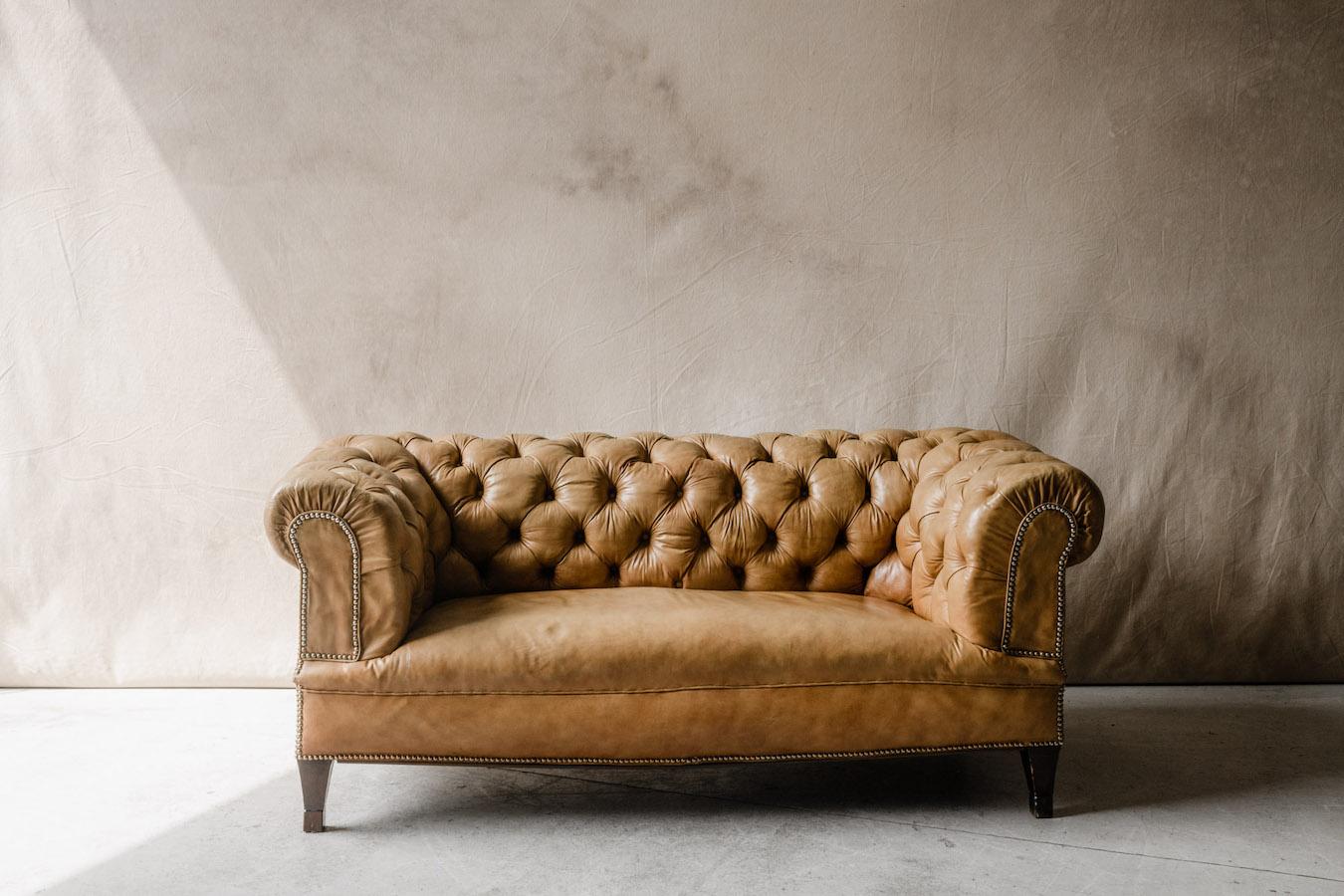 Vintage leather Chesterfield sofa from Denmark, Circa 1950. Original tan leather upholstery with nice wear and patina. Very comfortable.

     
    