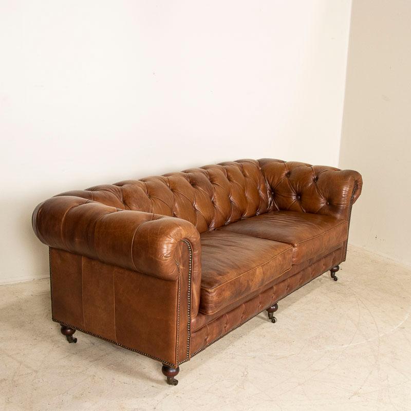 English Vintage Leather Chesterfield Sofa from England on Castors