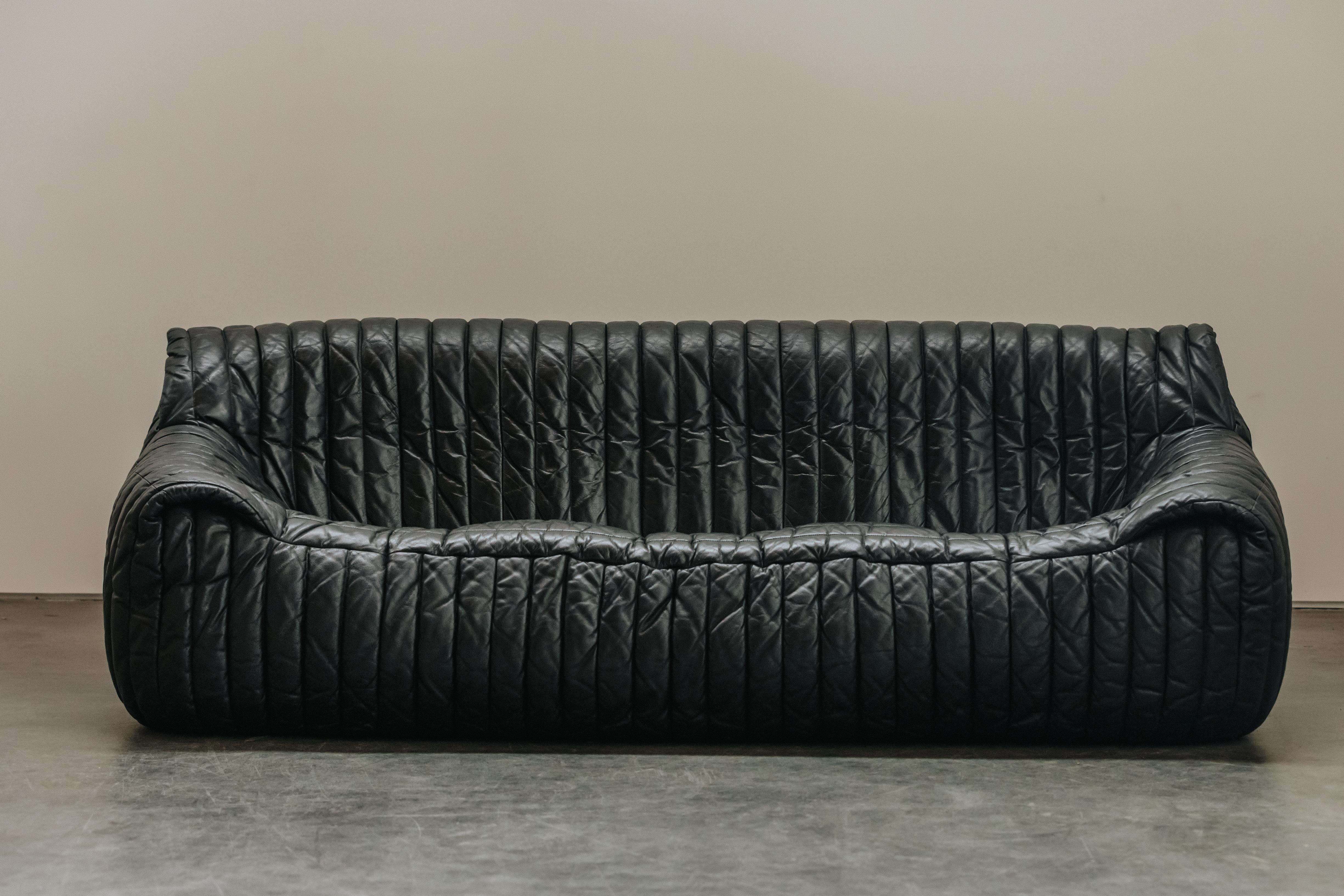 Vintage Leather Cinna Three Seater Sofa From France, Circa 1970.  Rare model with original black leather upholstery.  Nice patina and wear.