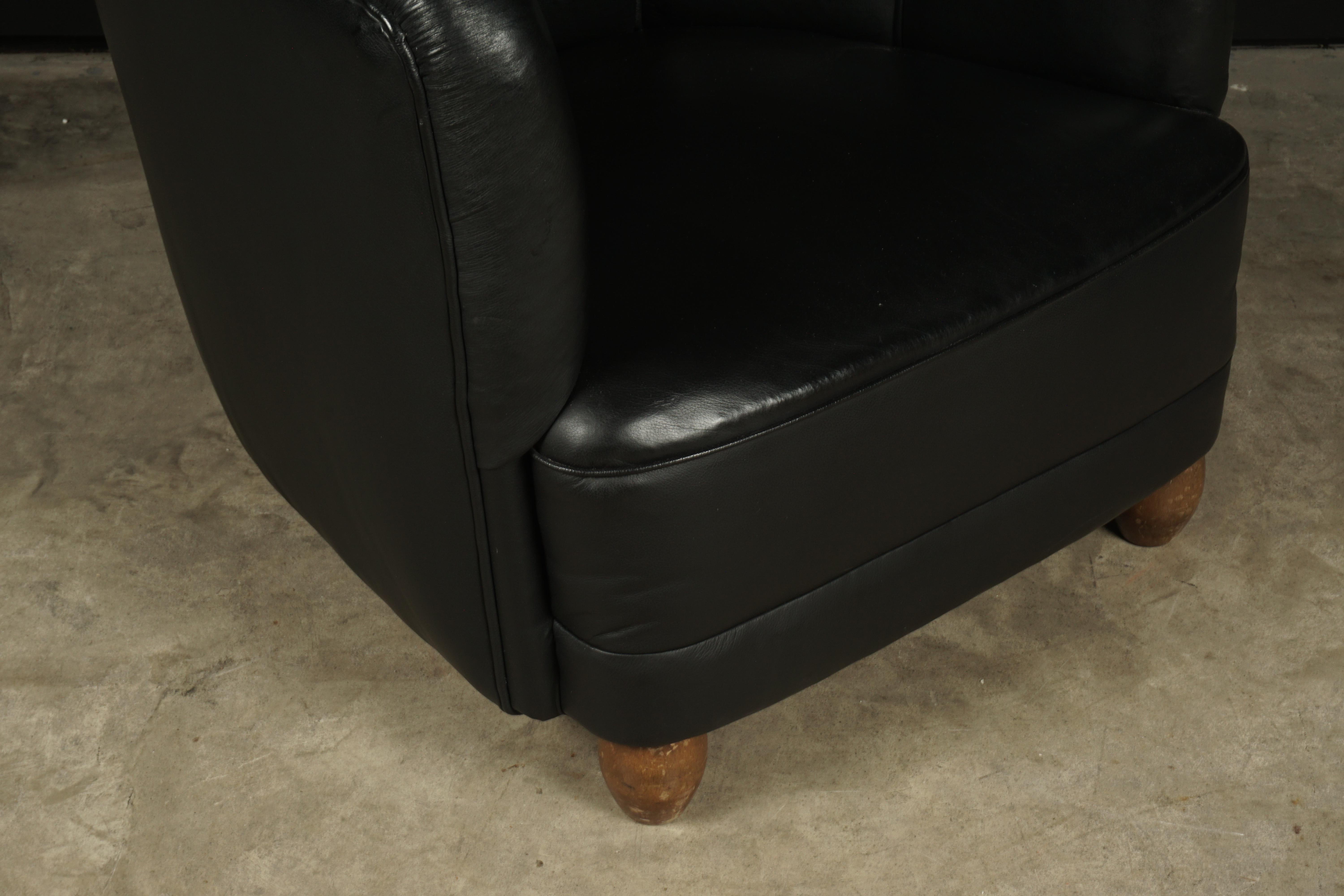 Vintage leather club chair from Denmark, circa 1950. Original black leather upholstery with nice patina and wear.
 