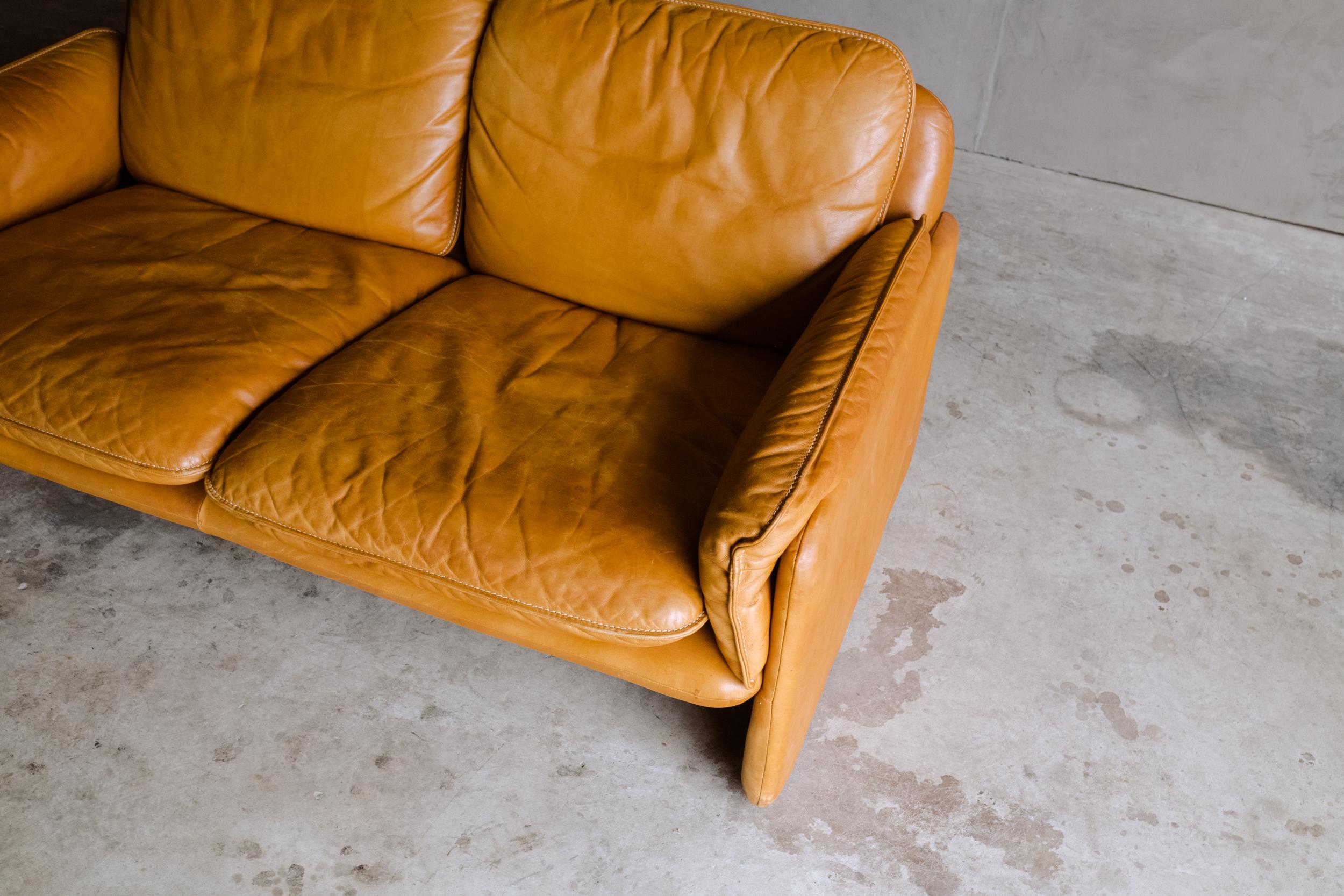 Vintage leather De Sede sofa From Switzerland, Circa 1970. Original cognac leather upholstery with fantastic color and patina.