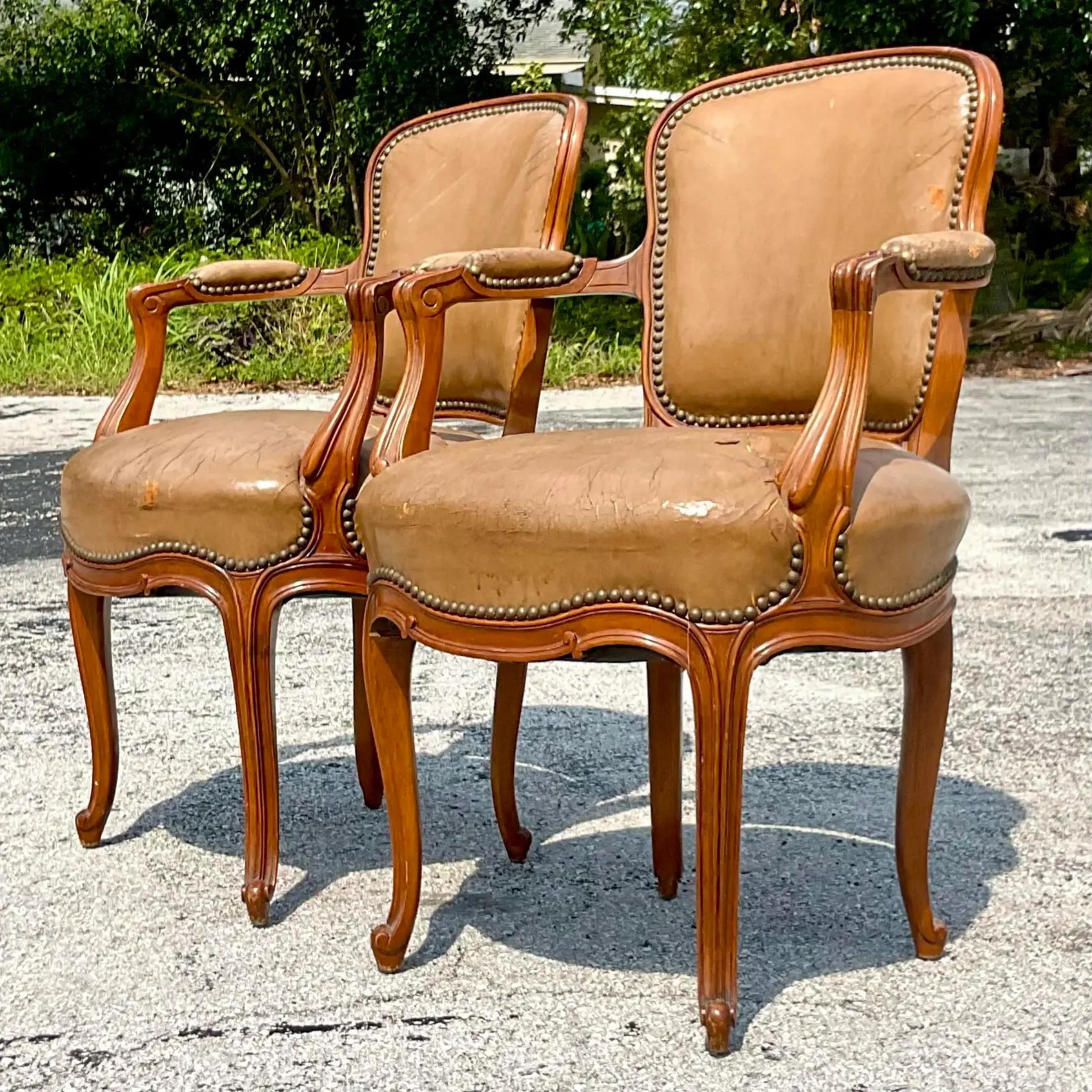 A fantastic pair of vintage leather dining chairs. A great addition to your dining room area. The chairs come with the wear and tear shown in the picture but we think it adds to the charm. Acquired at a Palm Beach estate.
