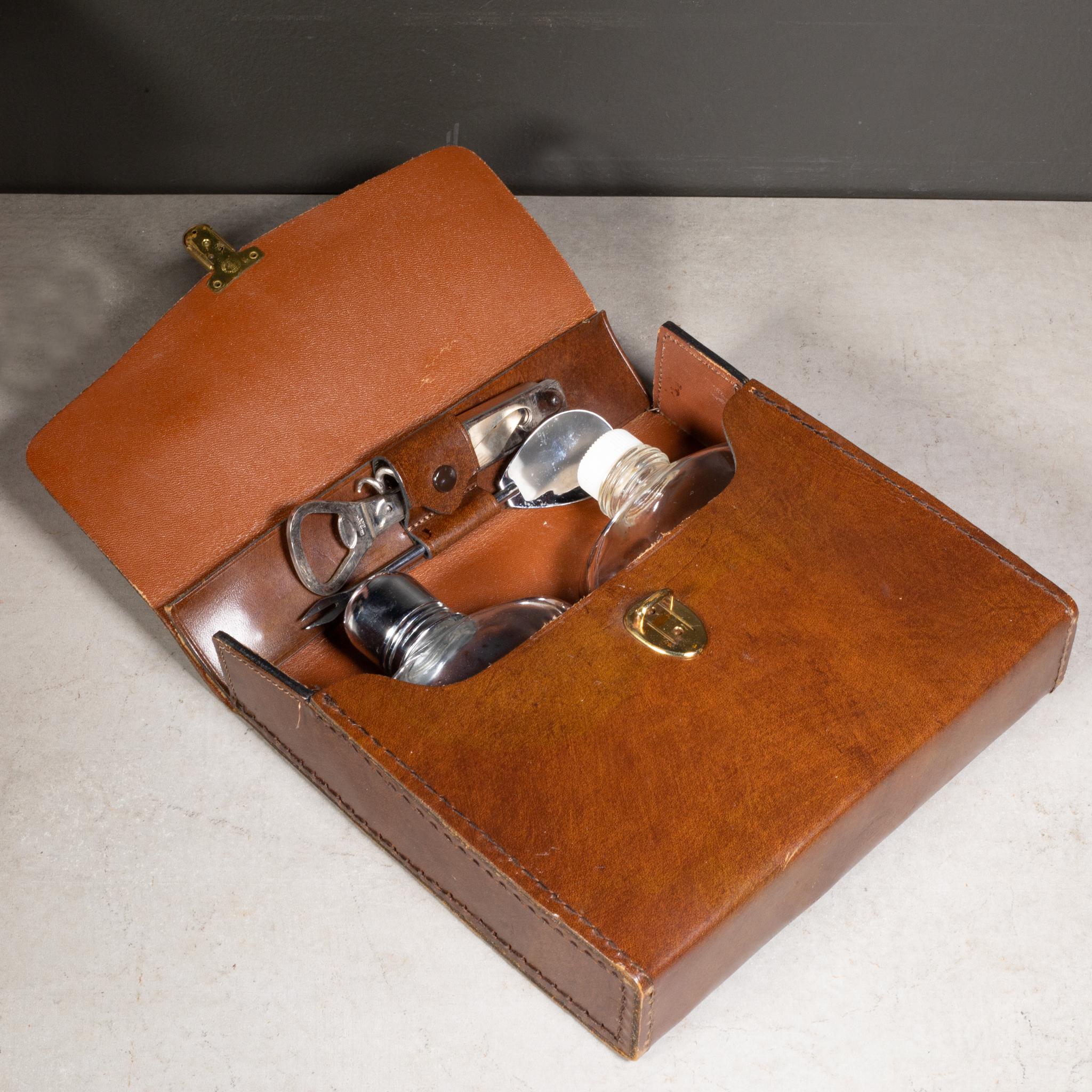 ABOUT

Vintage leather travel bar set with two glass flasks, metal shot lid, cork screw and a chrome bar spoon. Original key and leather pouch. 

    CREATOR Bosca, Italy. 
    DATE OF MANUFACTURE c.1970-1980. 
    MATERIALS AND TECHNIQUES Glass,
