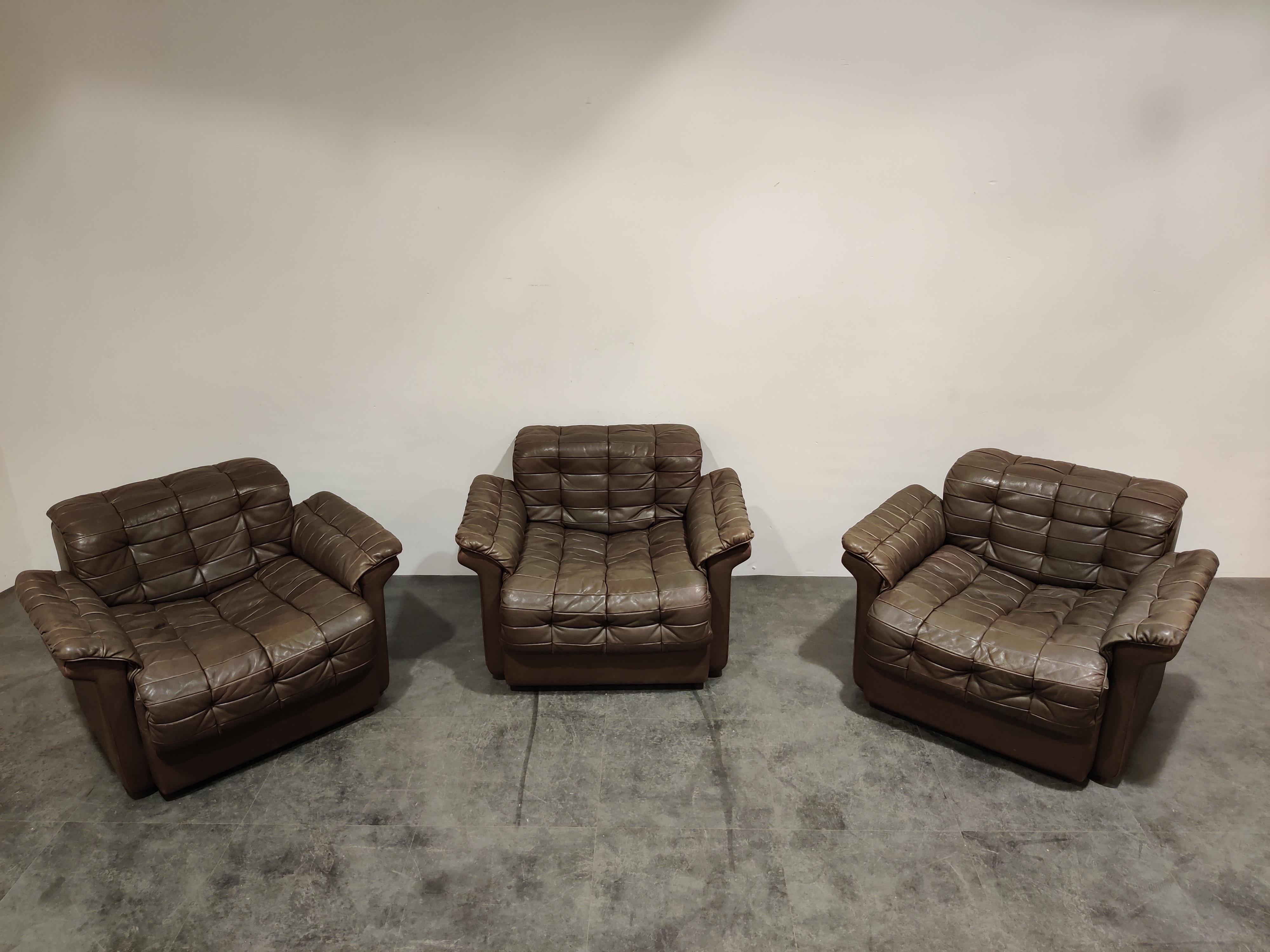 Vintage patchworl 'taupe' coloured leather (grey brown) armchairs by De Sede.

Model DS-11 - rare model, especially as armchairs.

As you would expect from De Sede, the chairs are very comfortable.

Good condition with normal age related wear.