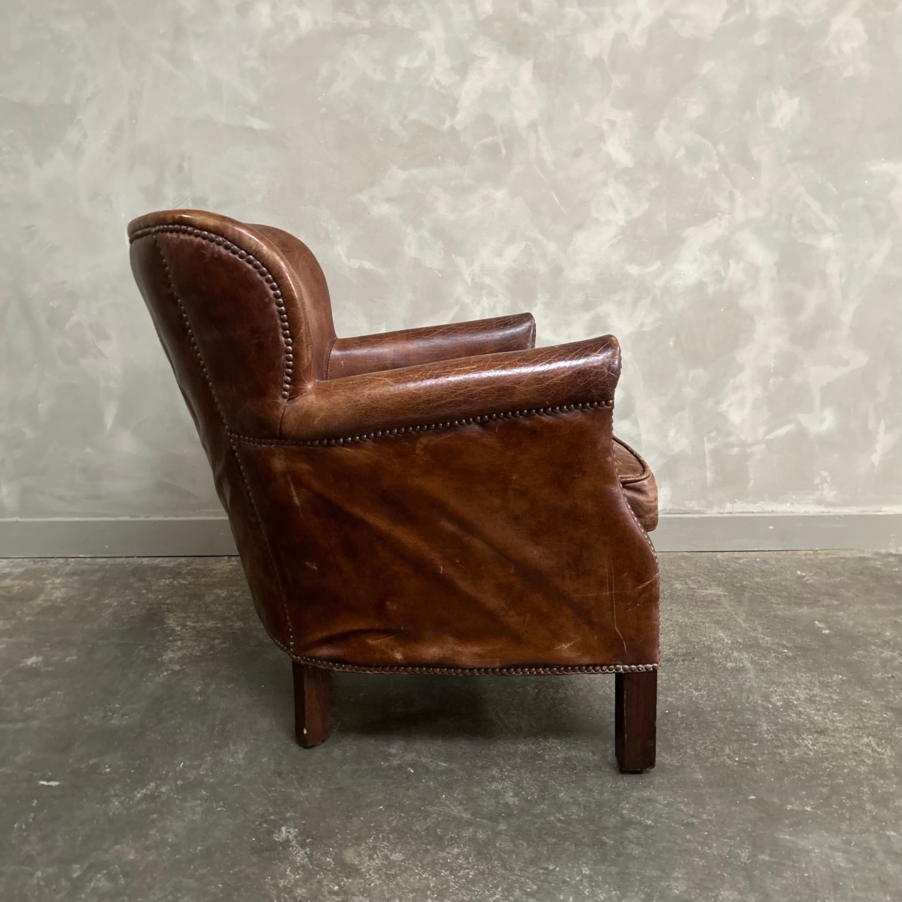 Leather Vintage leather English wing chair For Sale