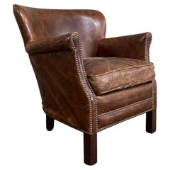 Fauteuil à oreilles anglais en cuir vintage