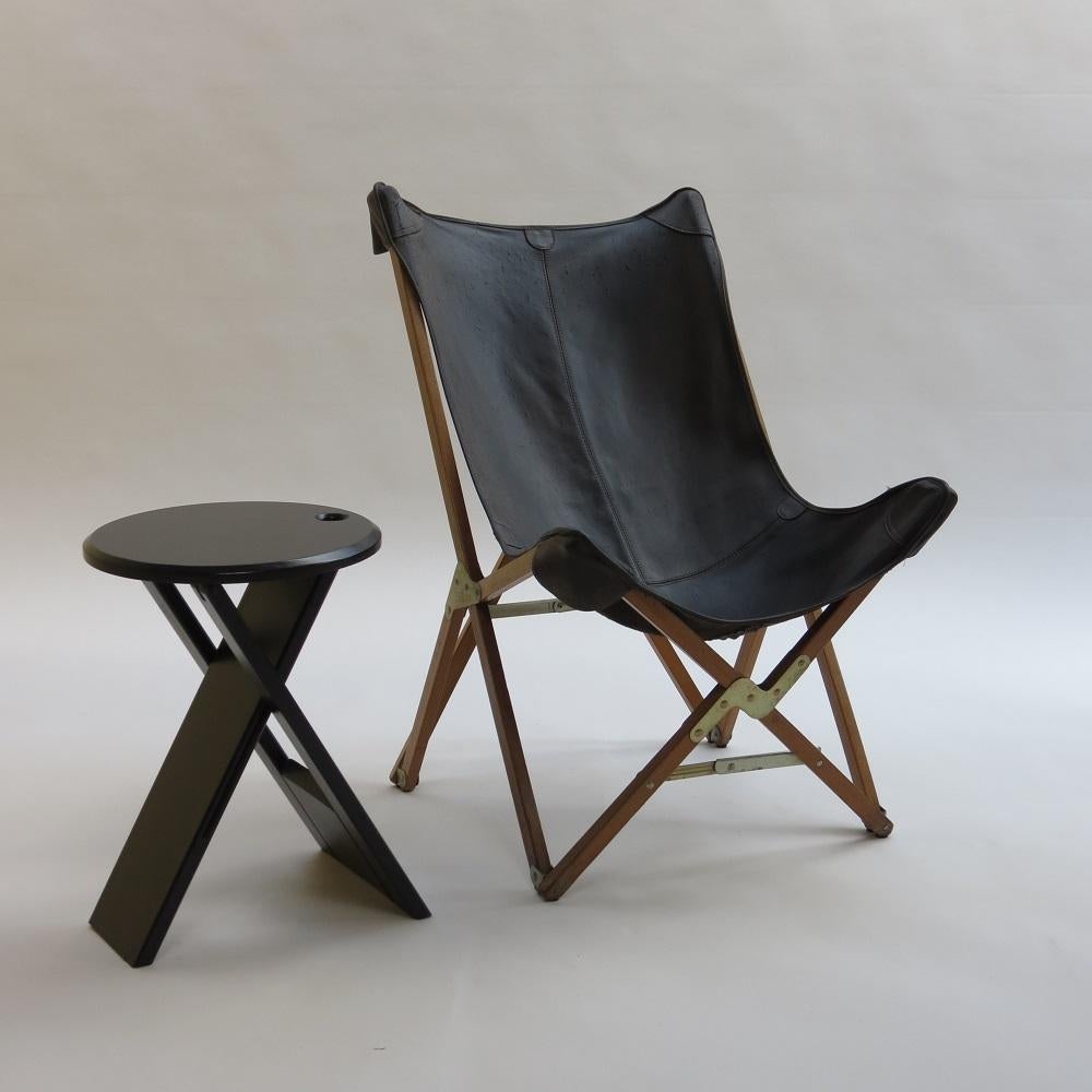A vintage leather and pine folding 'Hardoy' chair from the 1980s.  Dark brown leather sling on Birch frame with metal hinges.  The chair is of smaller scale than the more common Hardoy chair. Retains the original Princes Design Works Ltd