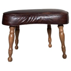 Tabouret de pied en cuir vintage