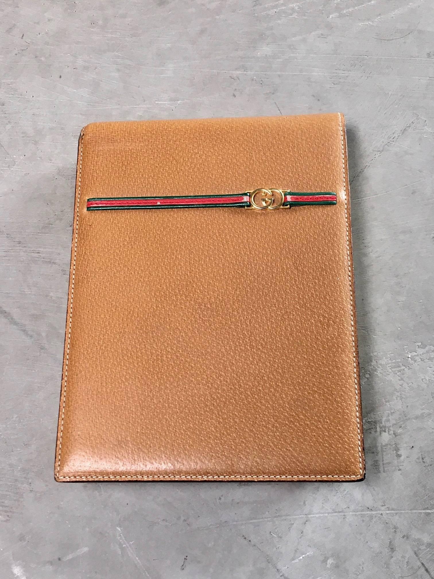 Handsome vintage tan leather Gucci notepad with red and green stripes and GG logo. Green leather back. Excellent patina to leather. Original, hardly used notepad inside. Great piece for the desktop or on the go.