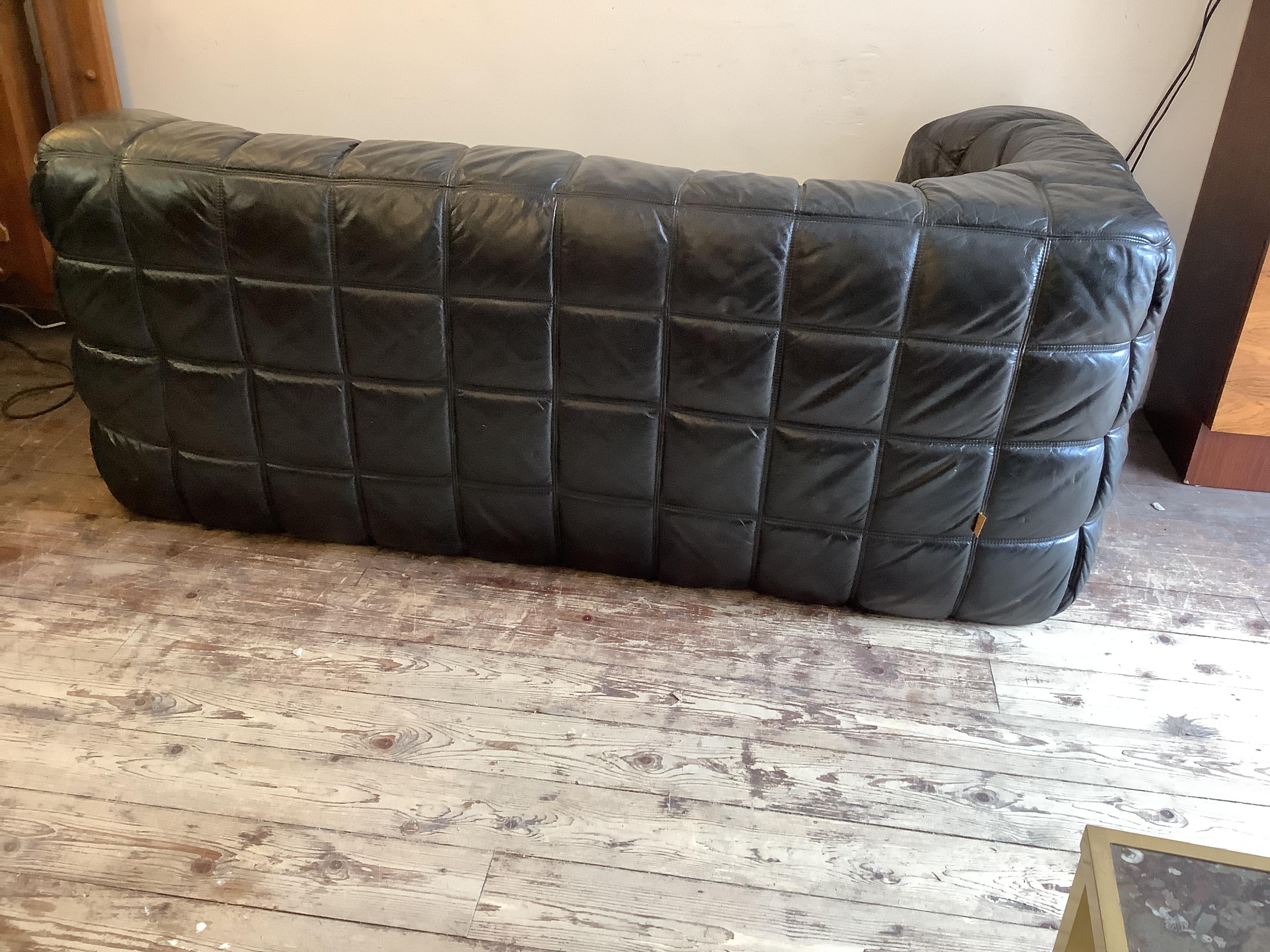 Super comfortable thick black leather 2 seater sofa.
Designed by Michel Ducaroy for Ligne Roset in 1976.
A Minimalist and powerful line. The seat element is 
Made of foam The Sofa is in good condition, there are slight traces of wear in places