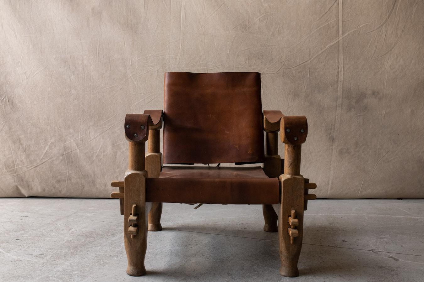 Vintage leather lounge chair from Brazil, circa 1960.  Solid wood construction stretched with thick saddle leather.  Light wear and use.

We don't have the time to write an extensive description on each of our pieces. We prefer to speak directly