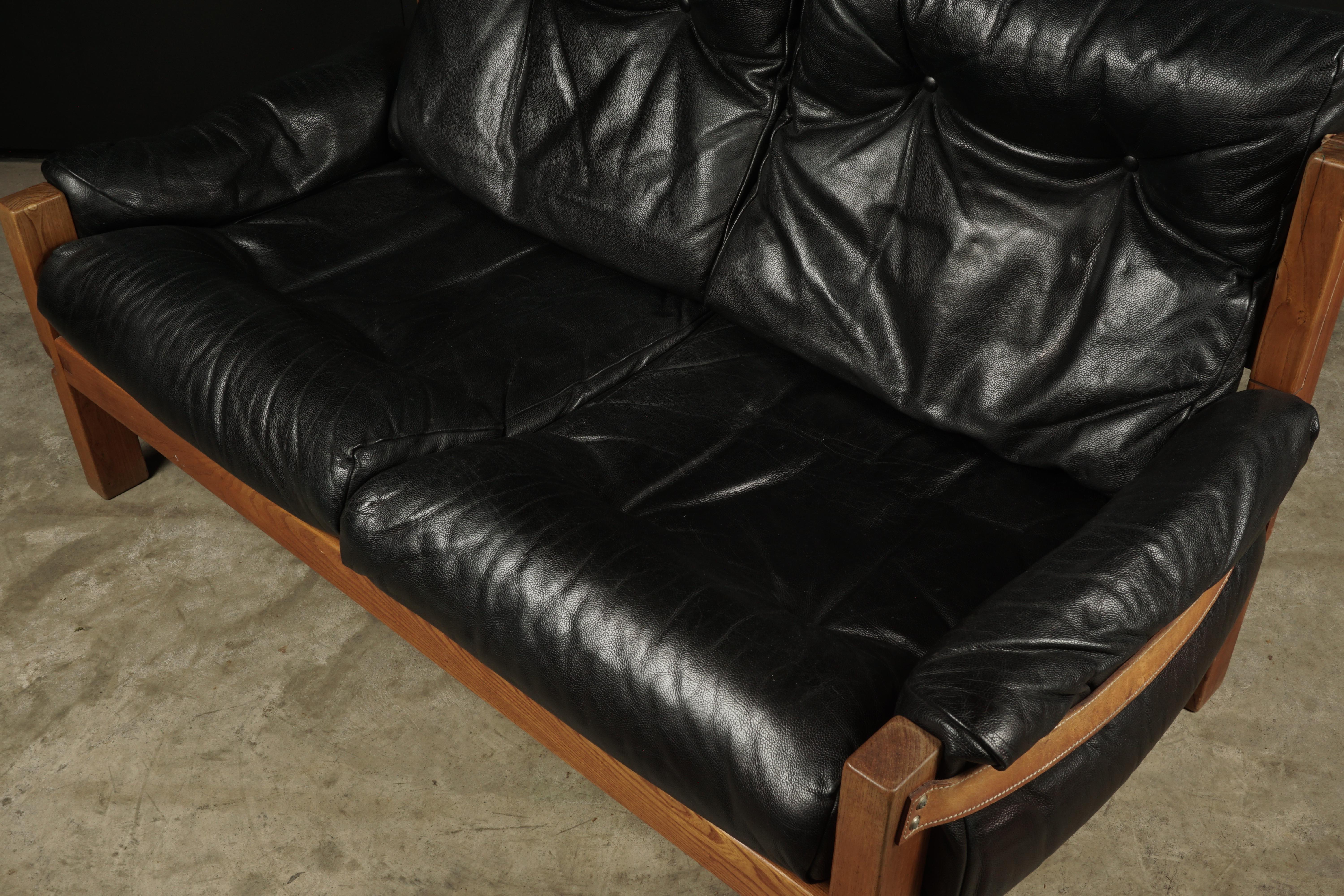 black leather love seat