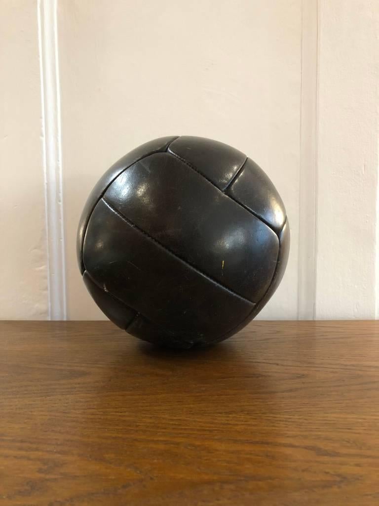 1940s medicine ball. From a gym in the former Czechoslovakia. Leather has been cleaned and treated. Made of patinated, thick cowhide. Weight: 3 kg.