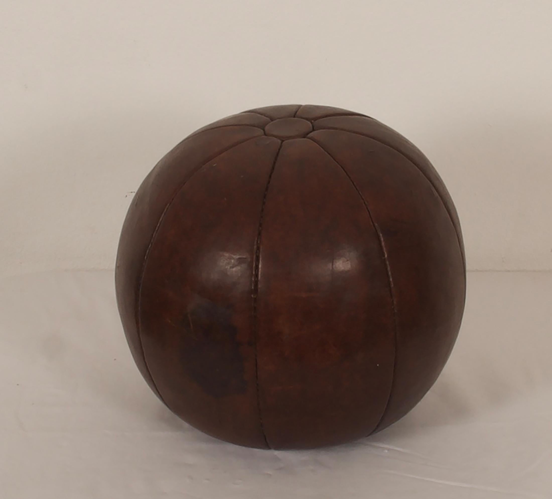 Original patinated leather medicine ball from the 1950s.