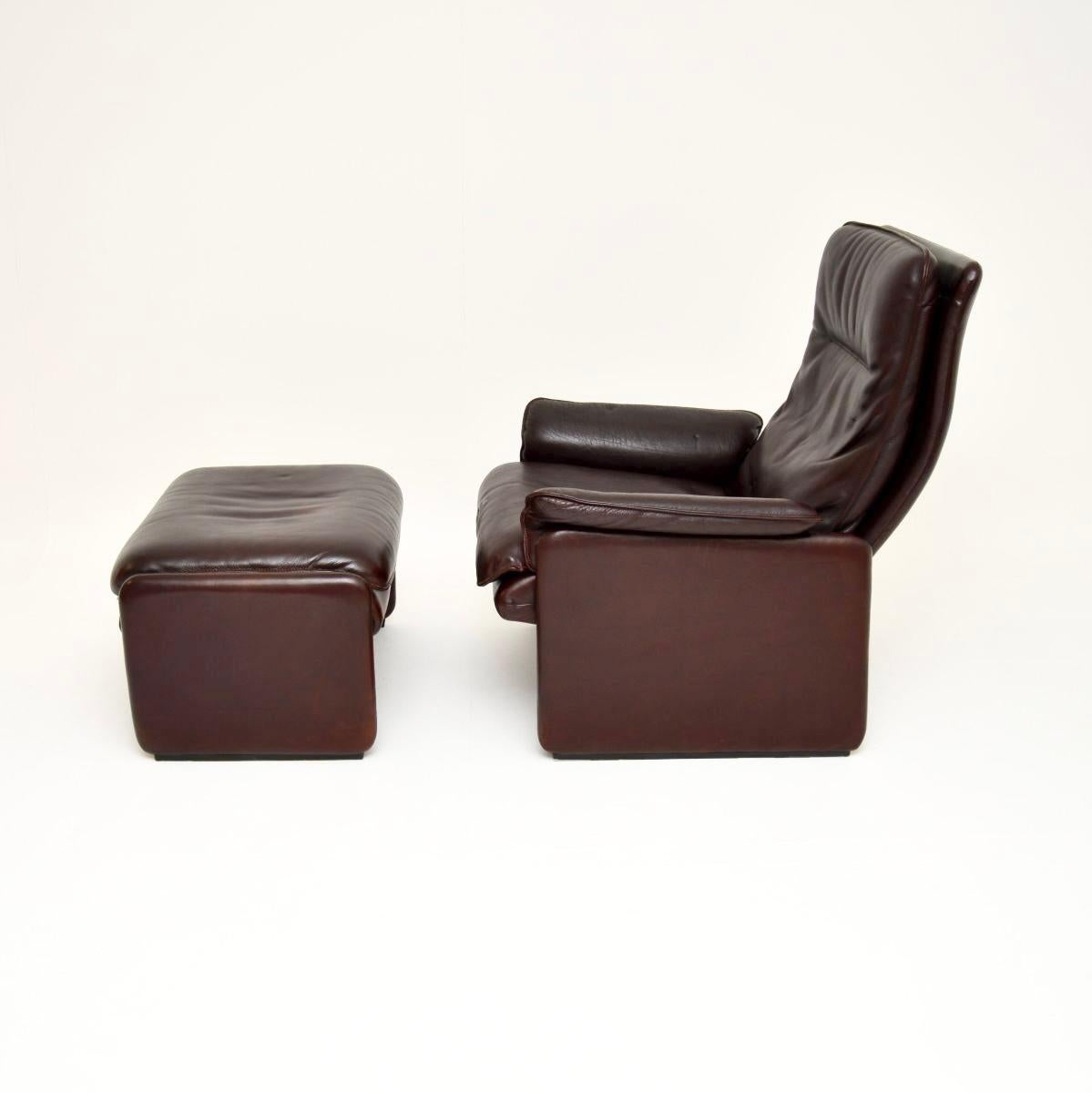 Swiss Vintage Leather Reclining Armchair and Stool by De Sede For Sale
