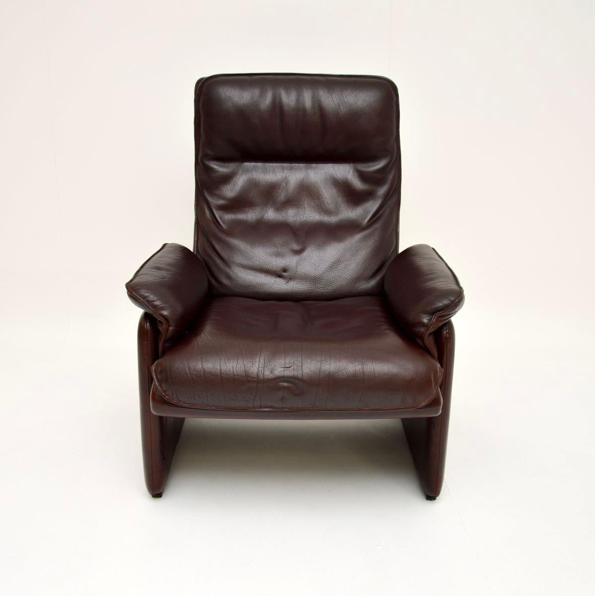 Mid-20th Century Vintage Leather Reclining Armchair and Stool by De Sede For Sale