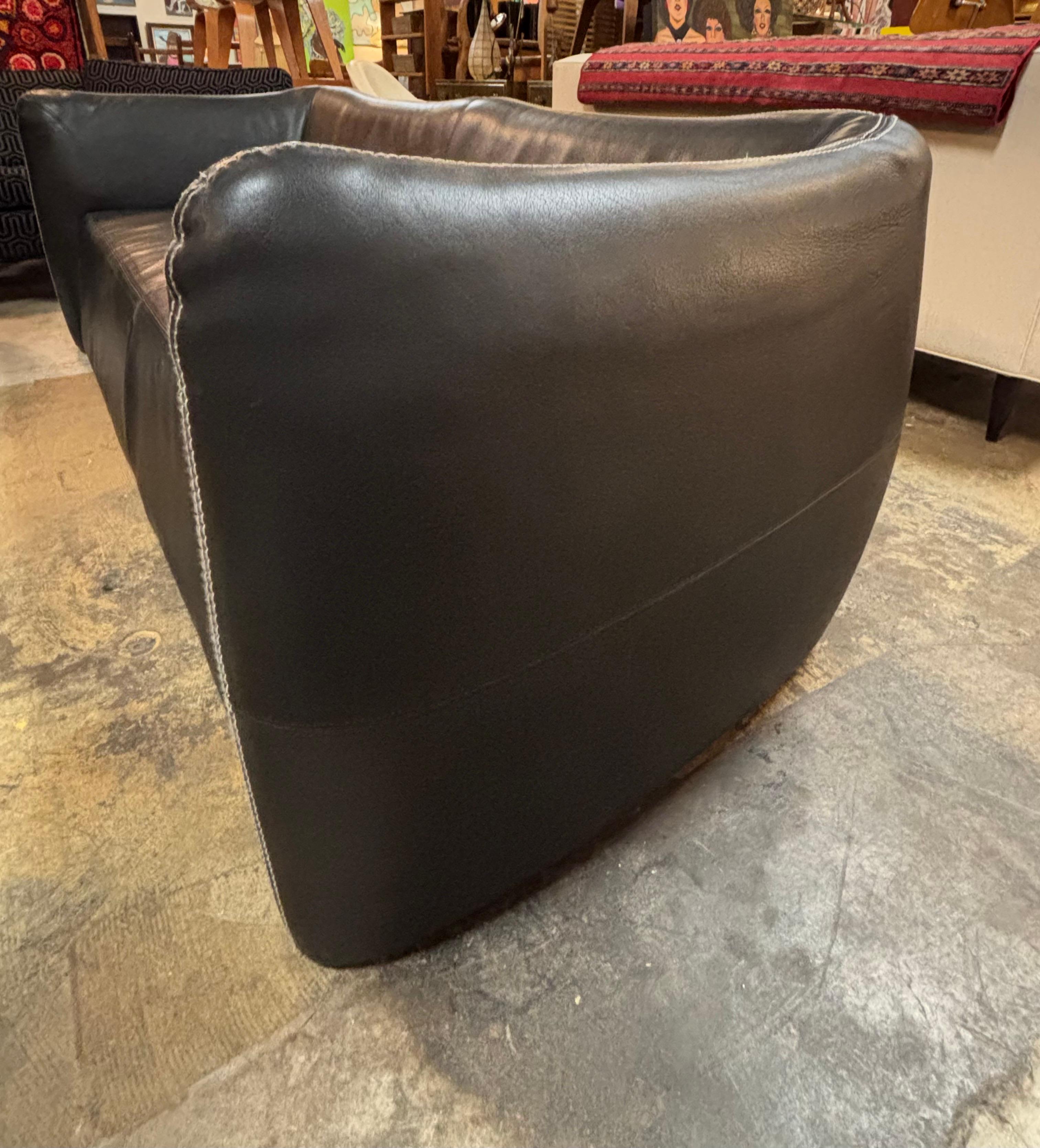 Vintage sofa made of black leather, Belgium, circa 1970s. This leather sofa is in great overall condition with small scuff on one. corner as seen in photo. 

Dimensions: 82