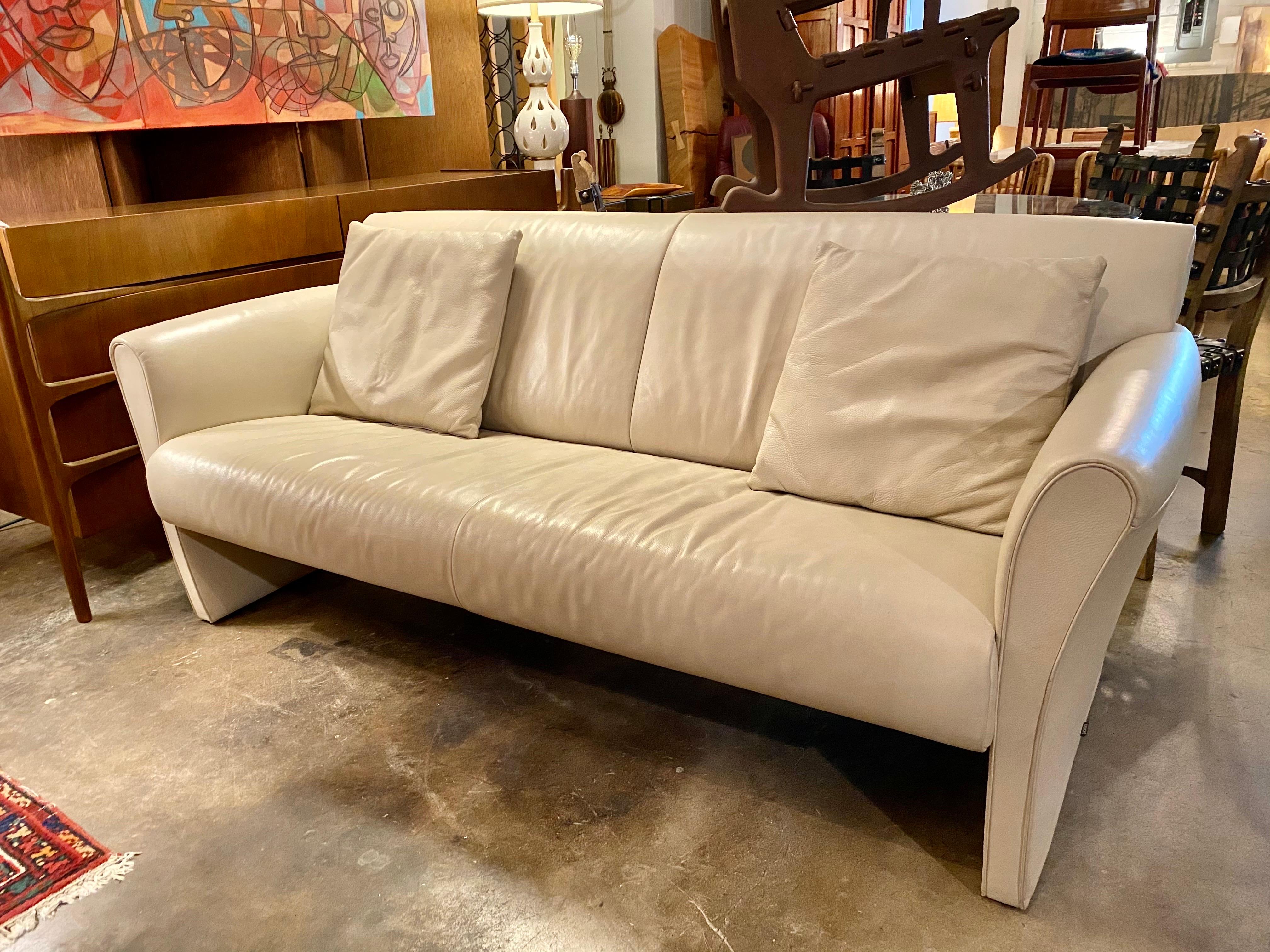 Vintage leather sofa in a cream color, Belgium, circa 1990’s. Founded in 1963, Jori is a Belgian company that specializes in high-quality and contemporary leather and fabric seating furniture.  This vintage leather sofa is in good overall condition.