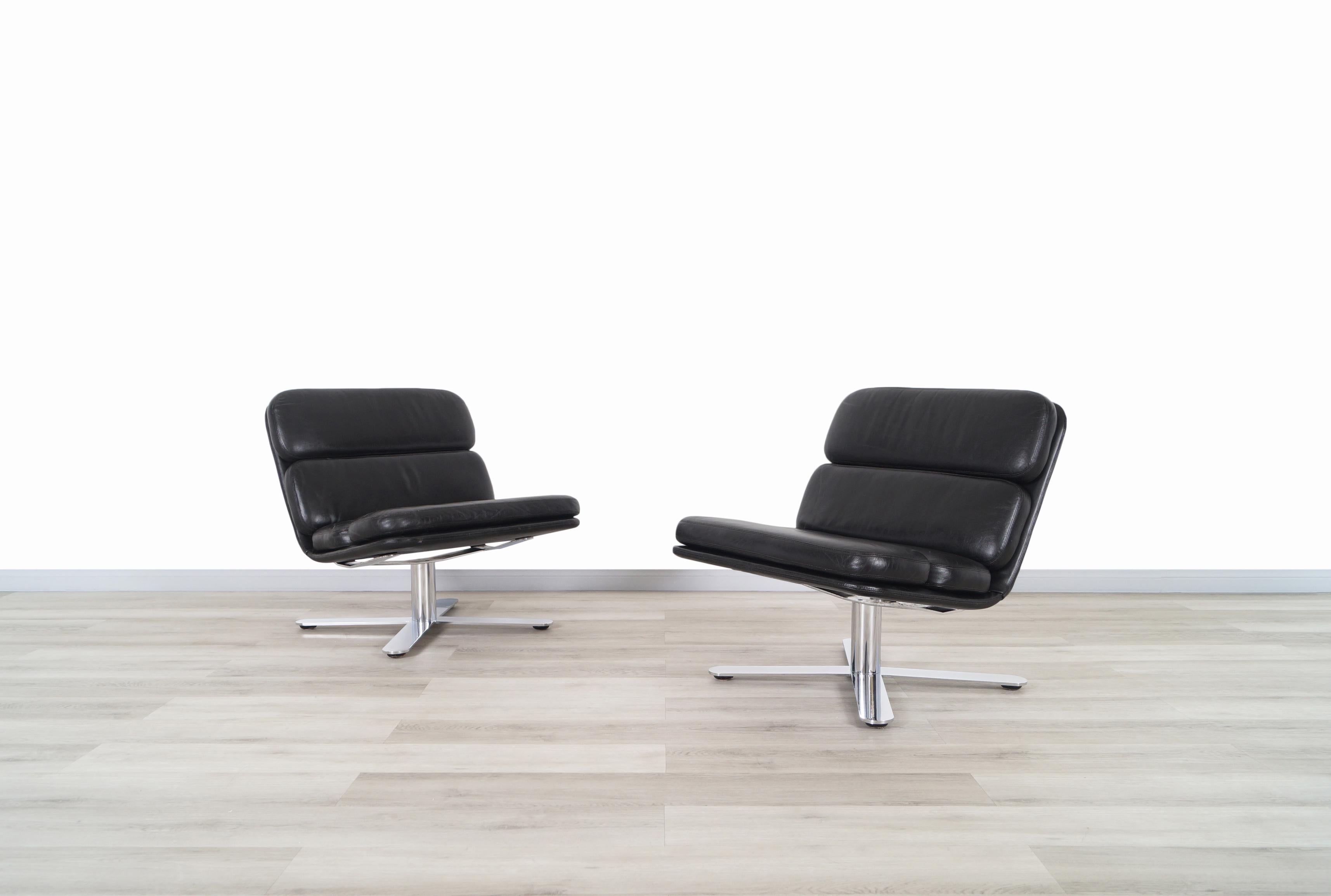 A stunning pair of vintage leather and chrome lounge chairs designed by John Follis for Fortress in the United States, circa 1970s. They are known as the 