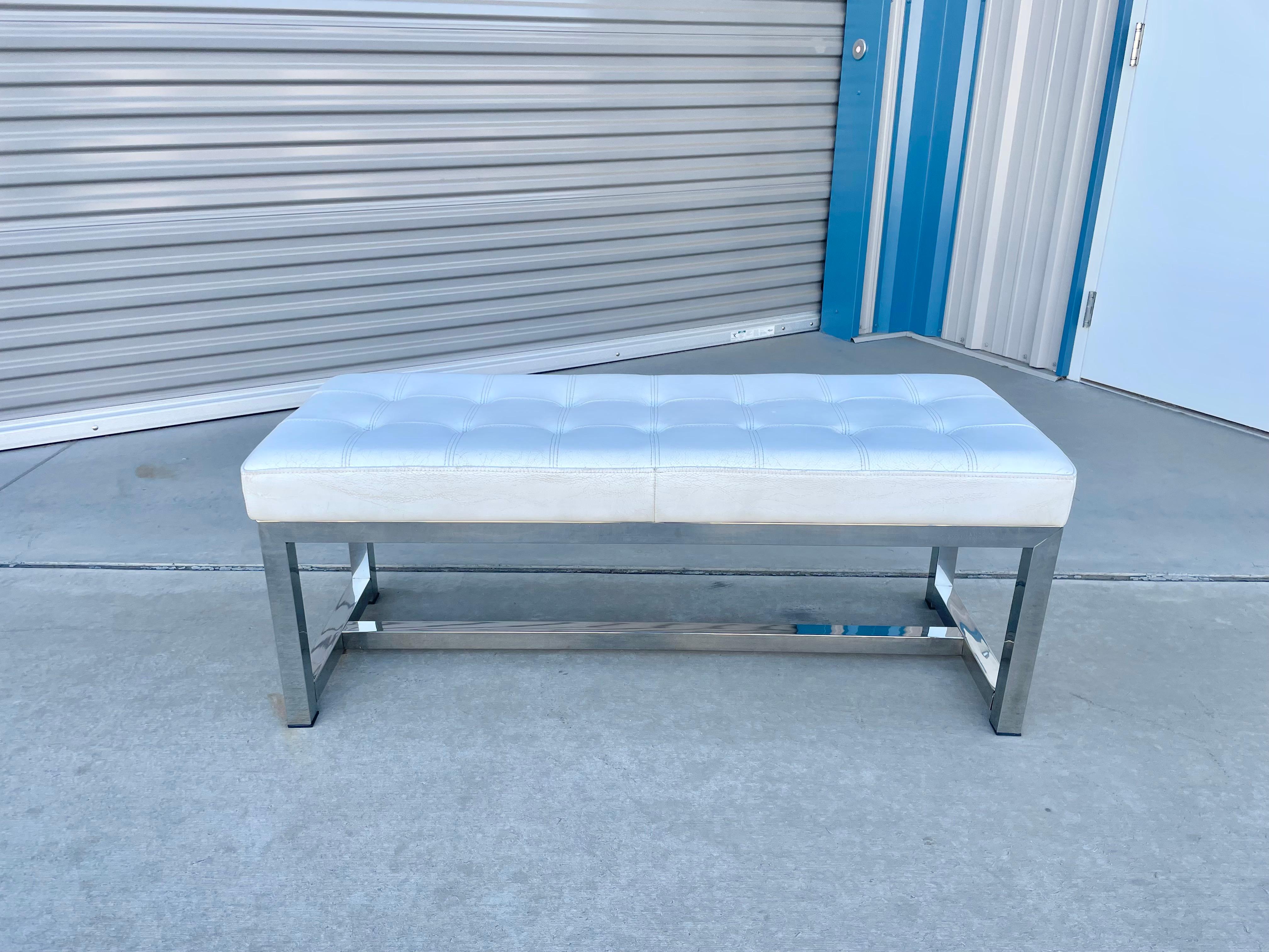 Beautiful vintage leather & steel bench designed and manufactured in the united states circa 1970s. This bench features a leather upholstery on top of a stainless steel base
