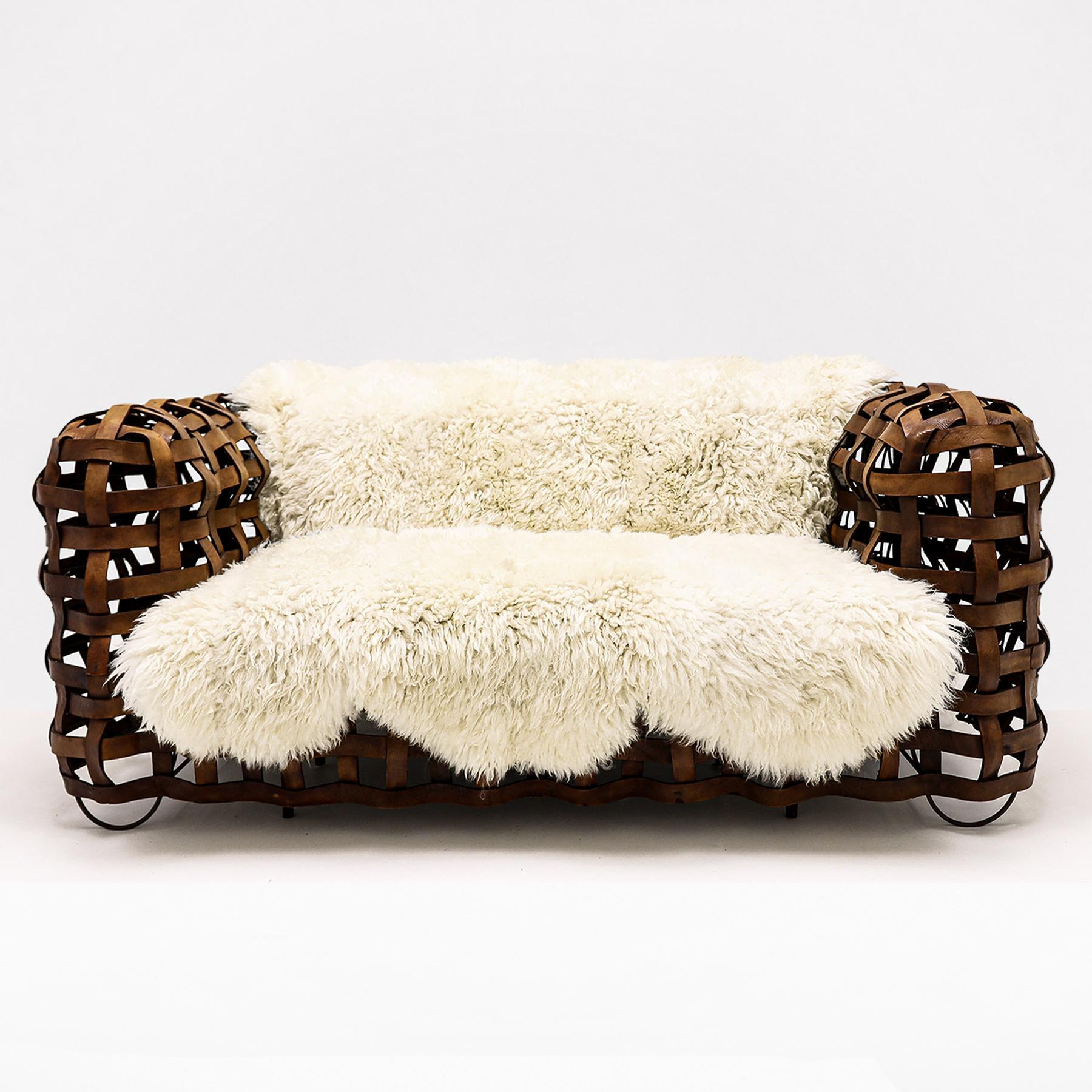 Bohemian Vintage Leather strap sofa with upholstered seat and bespoke sheepskin throw