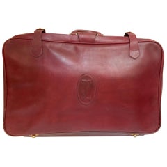 Valise en cuir vintage « Les Must de Cartier » bordeaux avec bagages