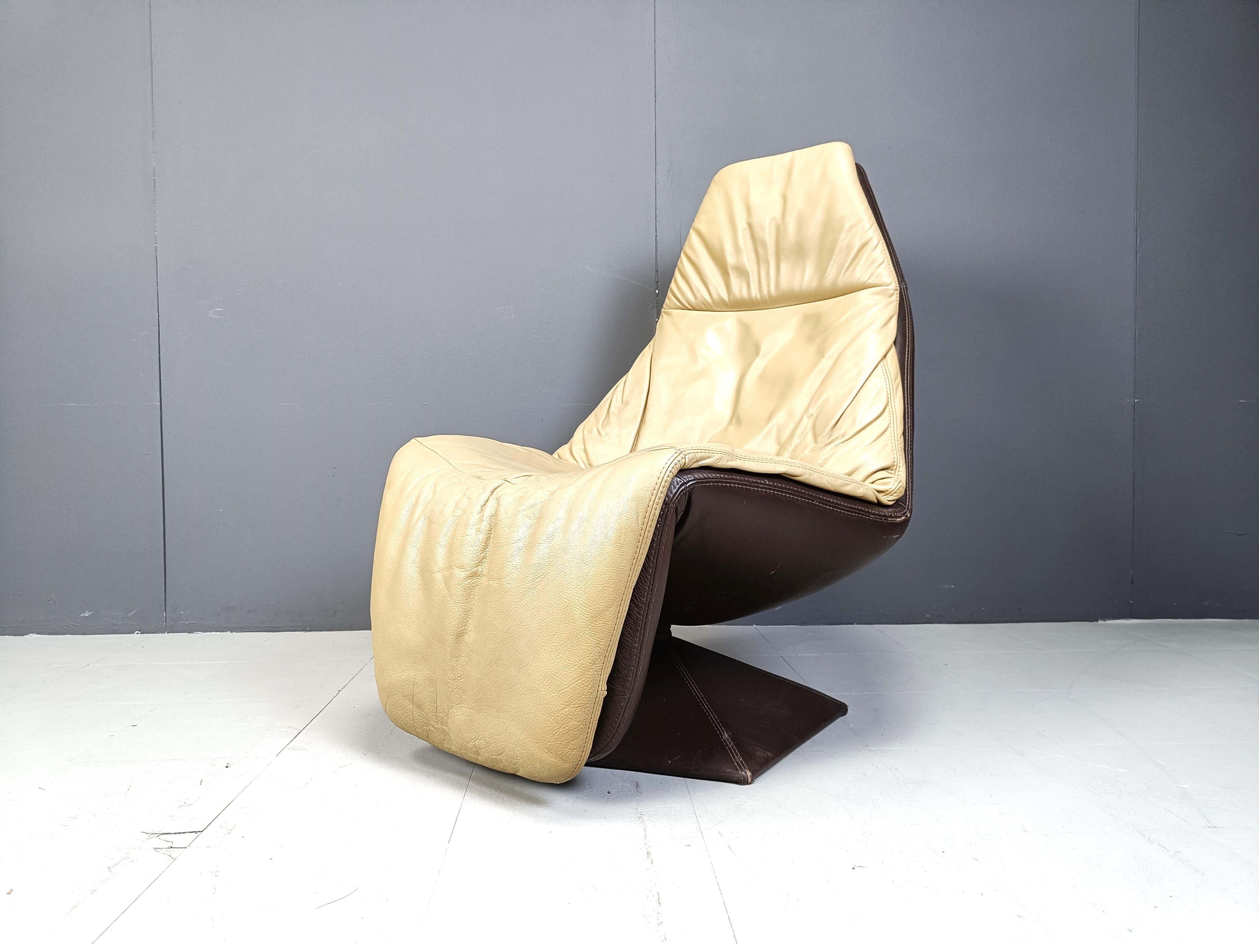 Leather Vintage leather swivel chair with ottoman, 1970s For Sale