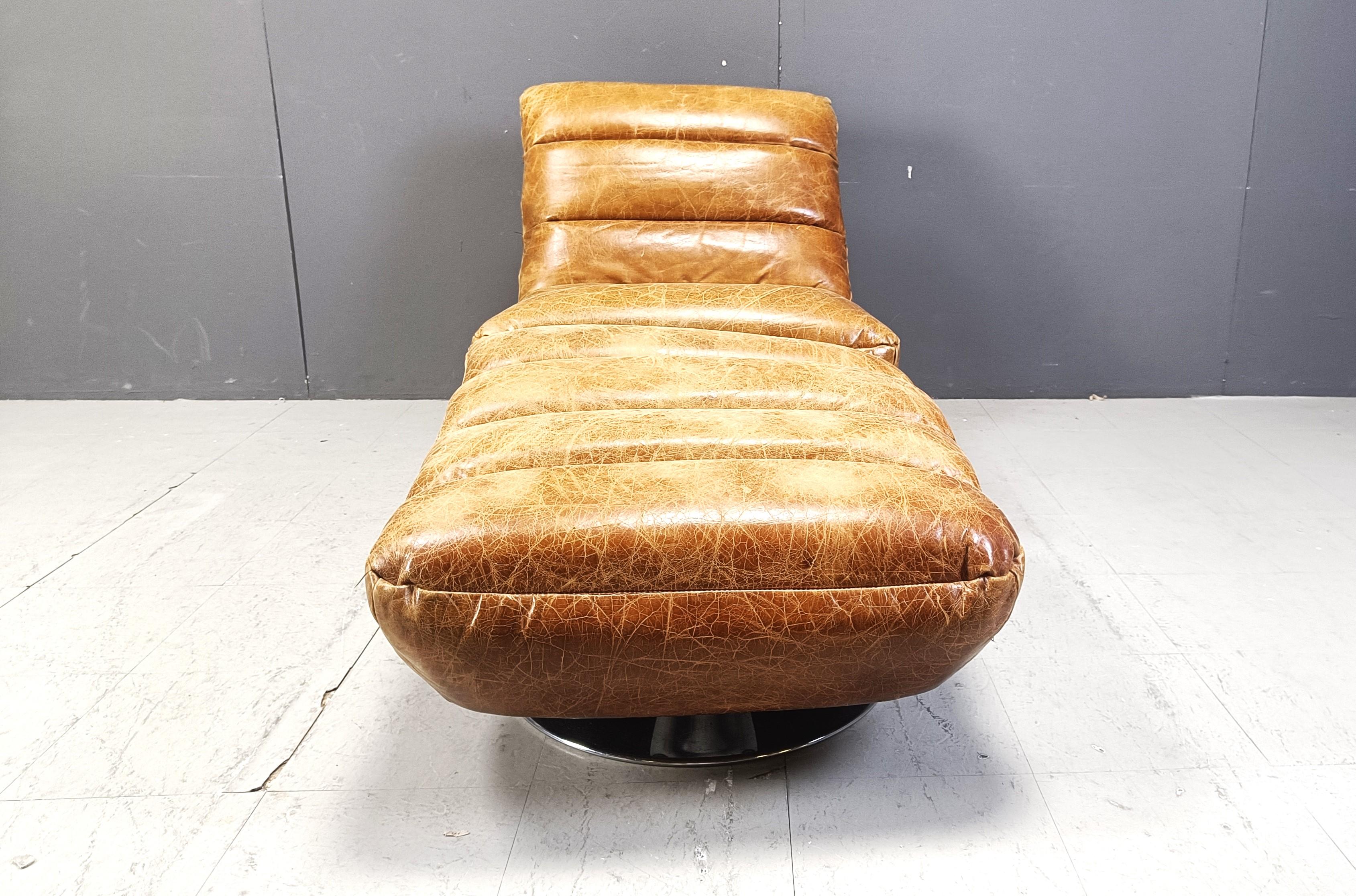 Mid-Century Modern Vintage leather swivel chair with stool, 1970s For Sale